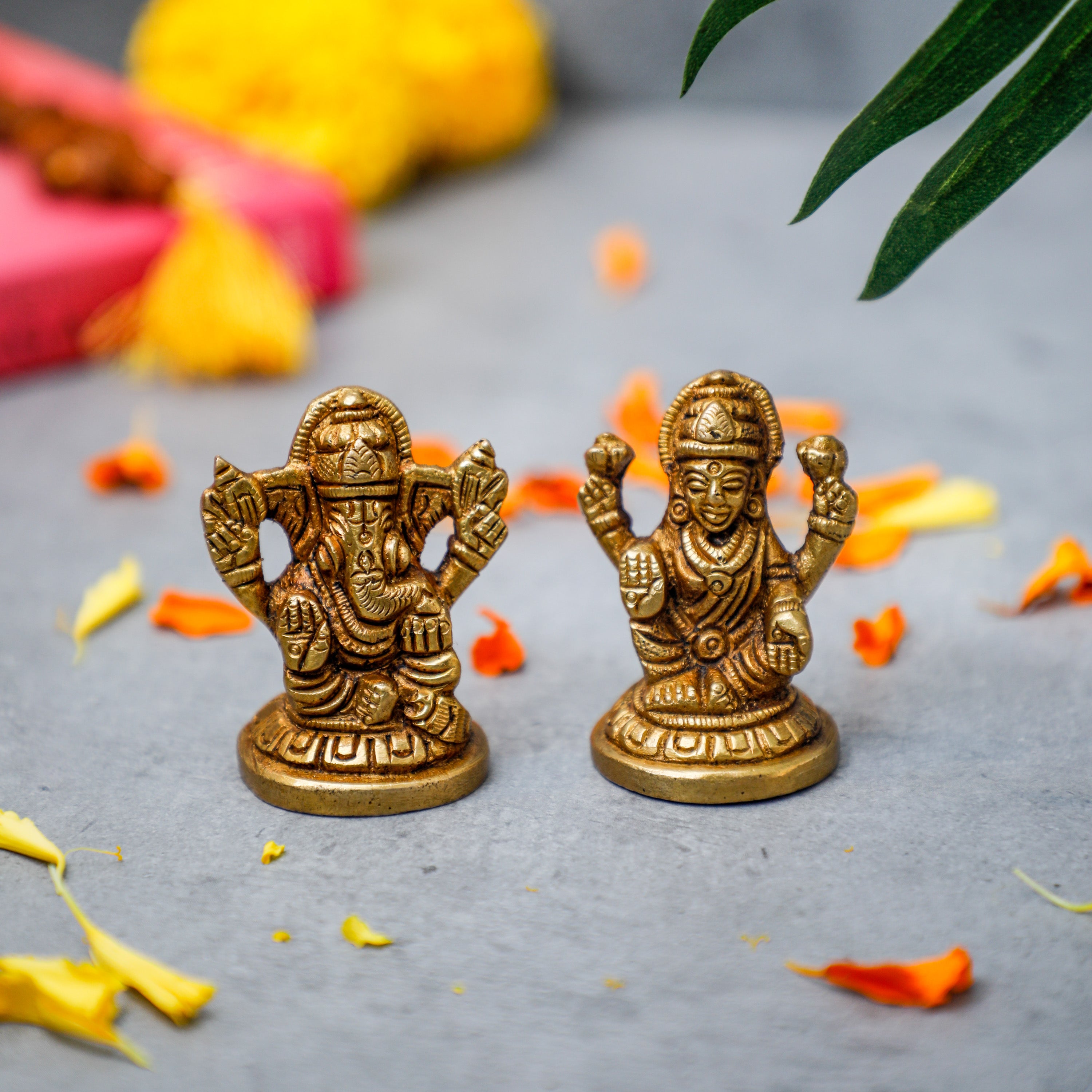 These handcrafted antique idols of Ganesha and Laxmi are made of 100% brass.
