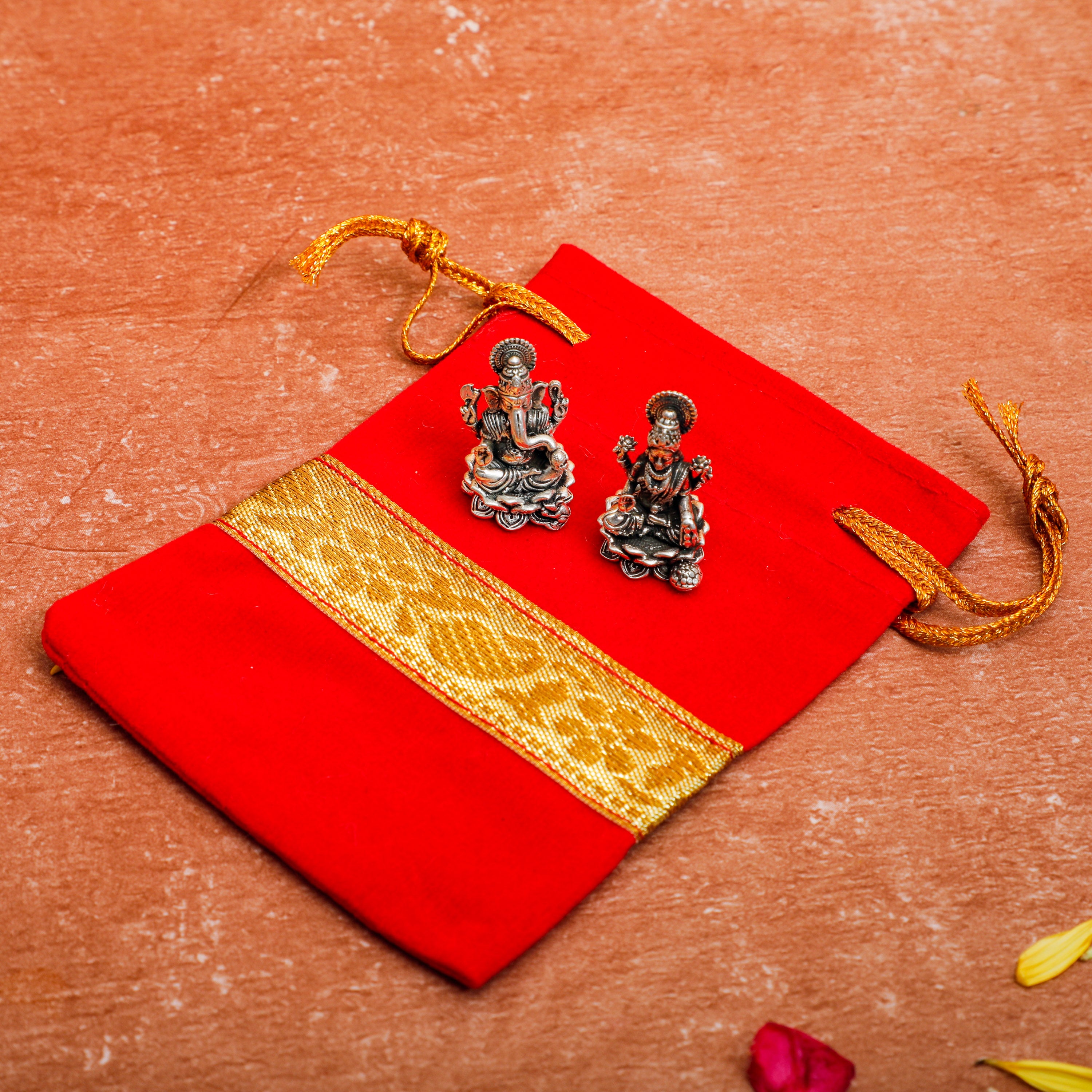 Pure silver idols placed on the velvet pouch