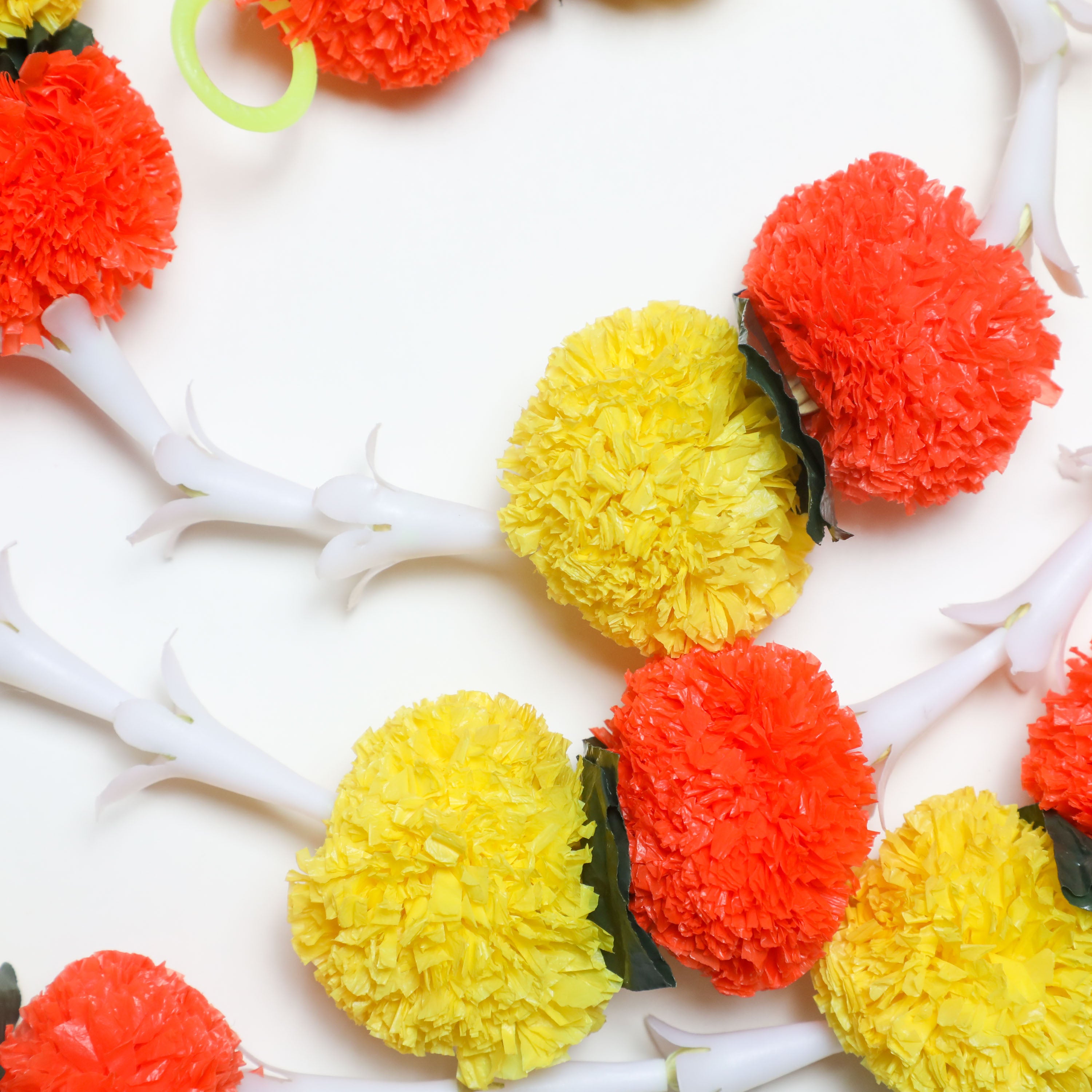 Fluffy floral marigold and lily garlands for Indian pooja decor