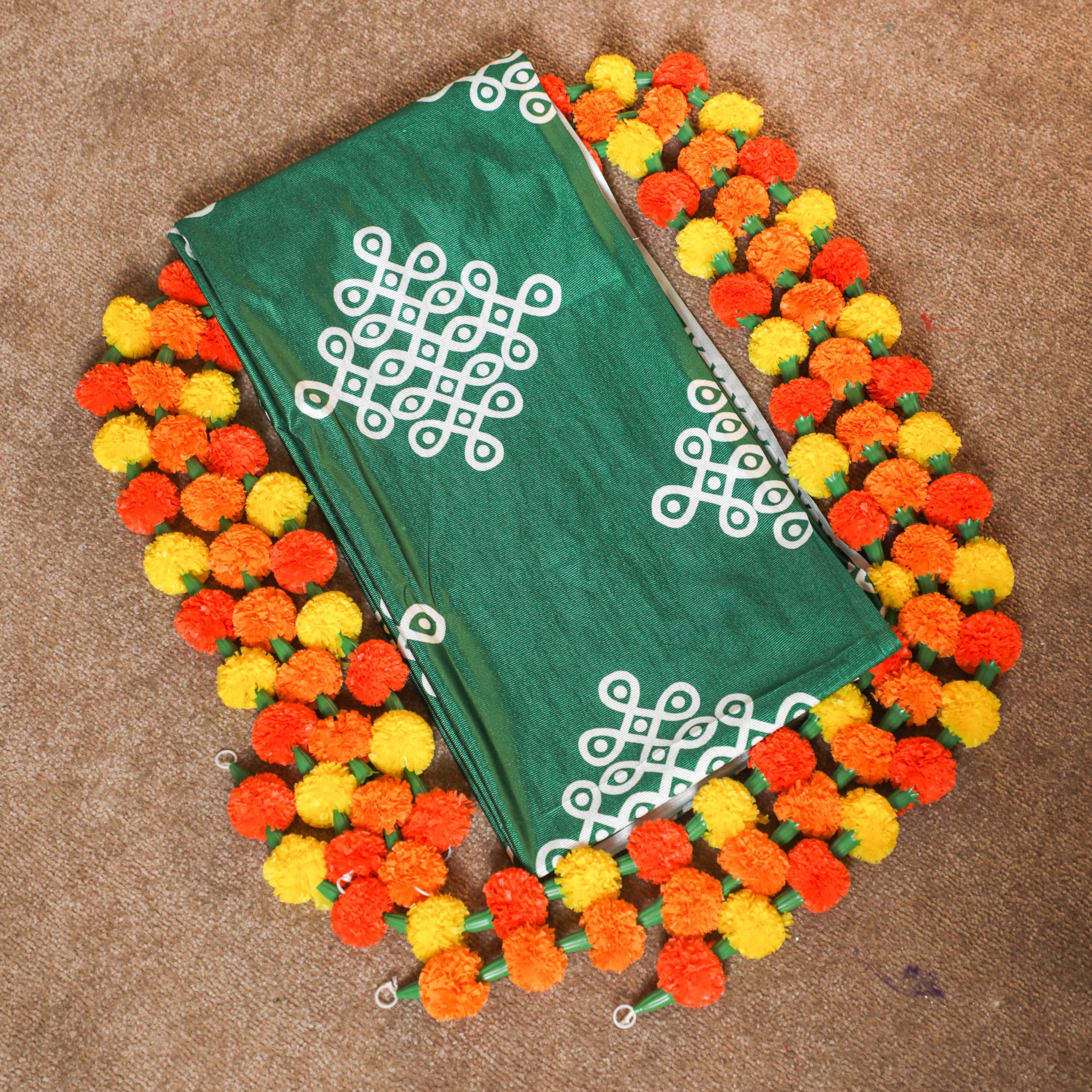 green color backdrop cloth with artificial garlands for decoration