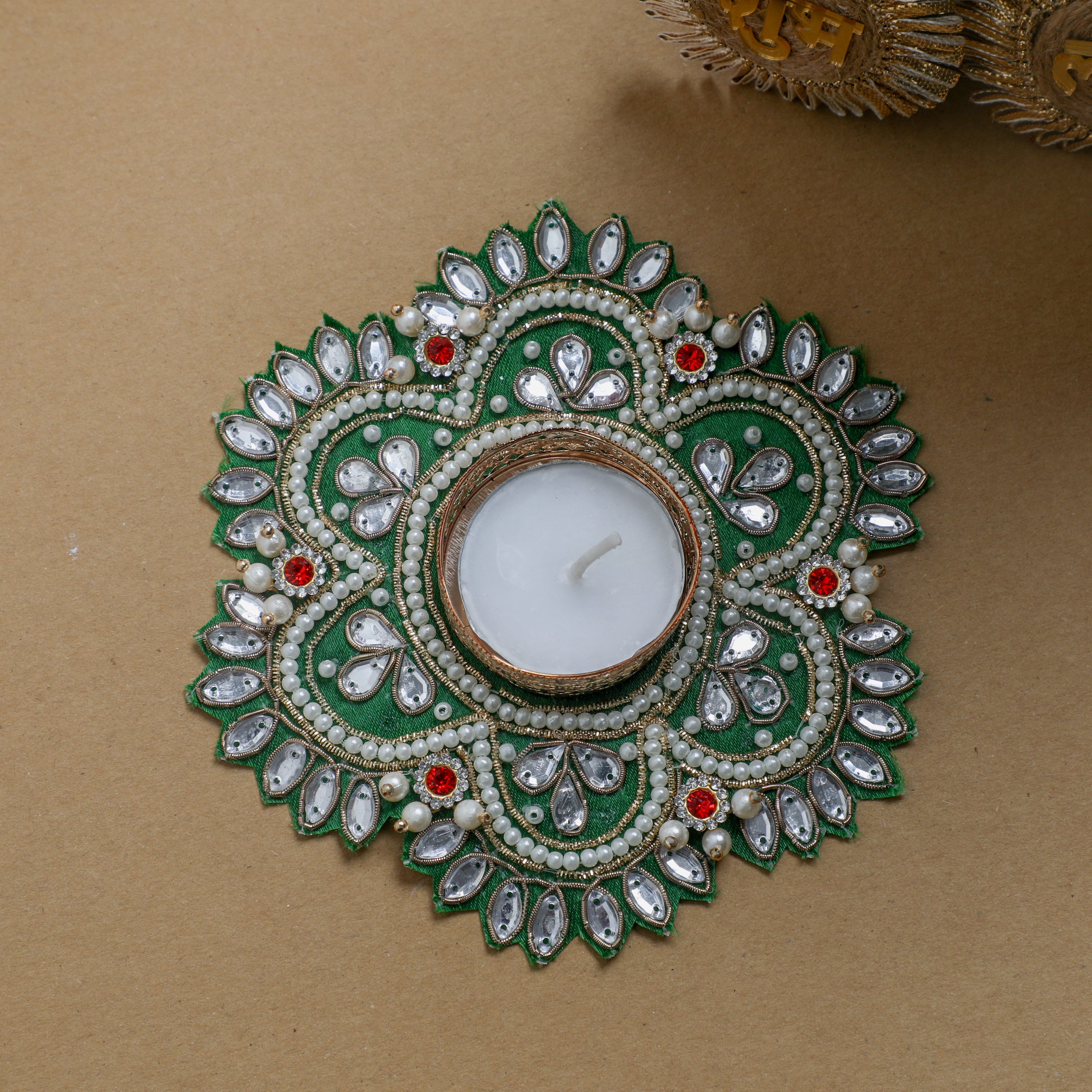 Handcrafted fabric diyas adorned with beads, pearls and stone work