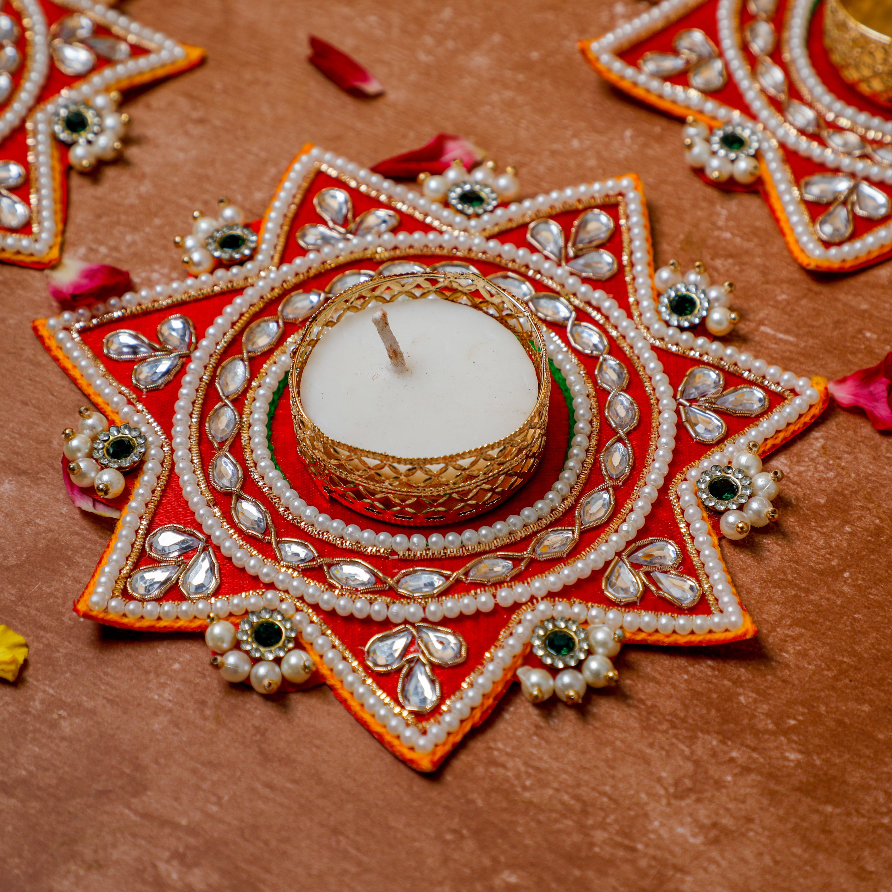 tea light candle holders are star shape, intricate gota patti designs, and artificial pearls and stones