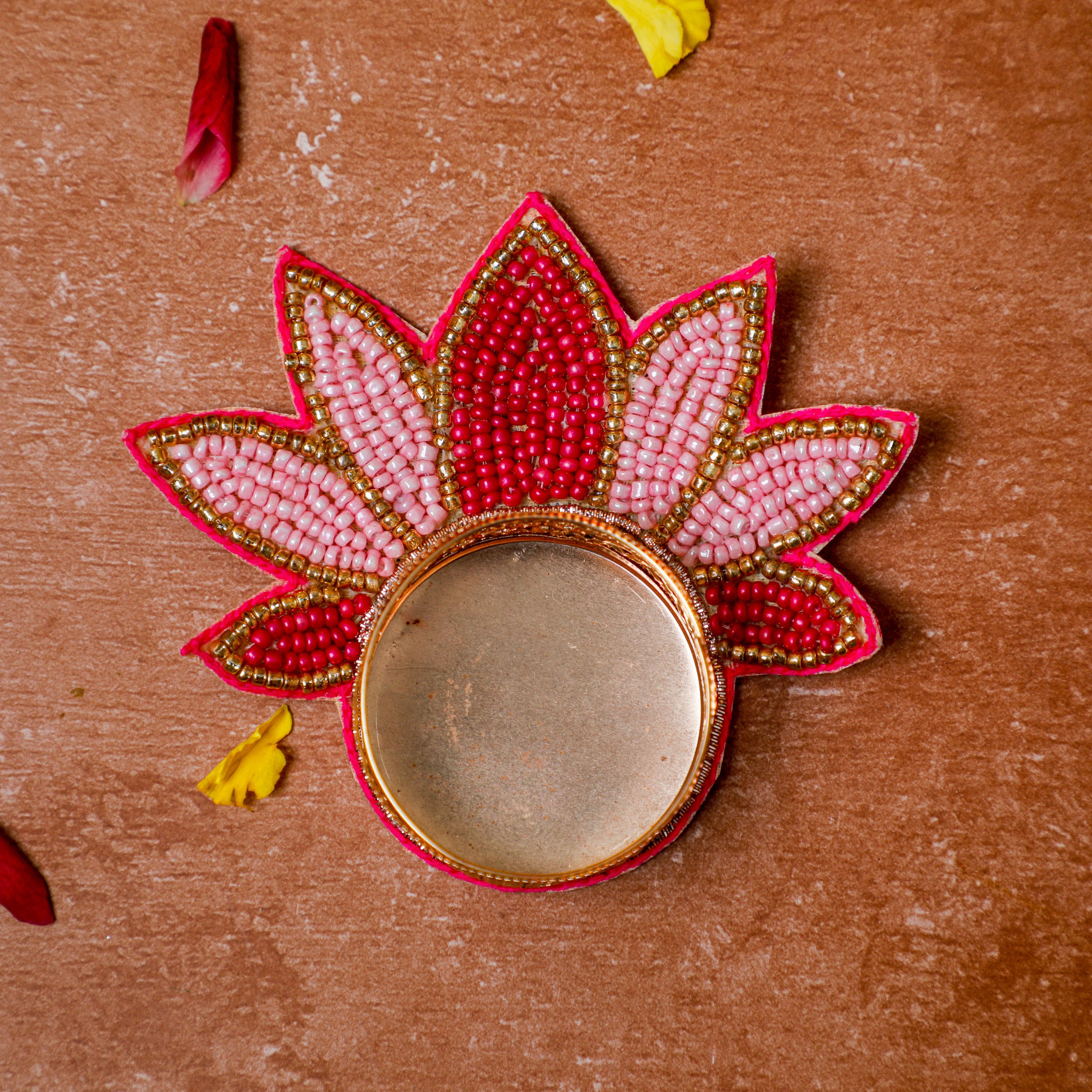 graceful lotus design adorned with an array of vibrant, mini pink beads are meticulously arranged 