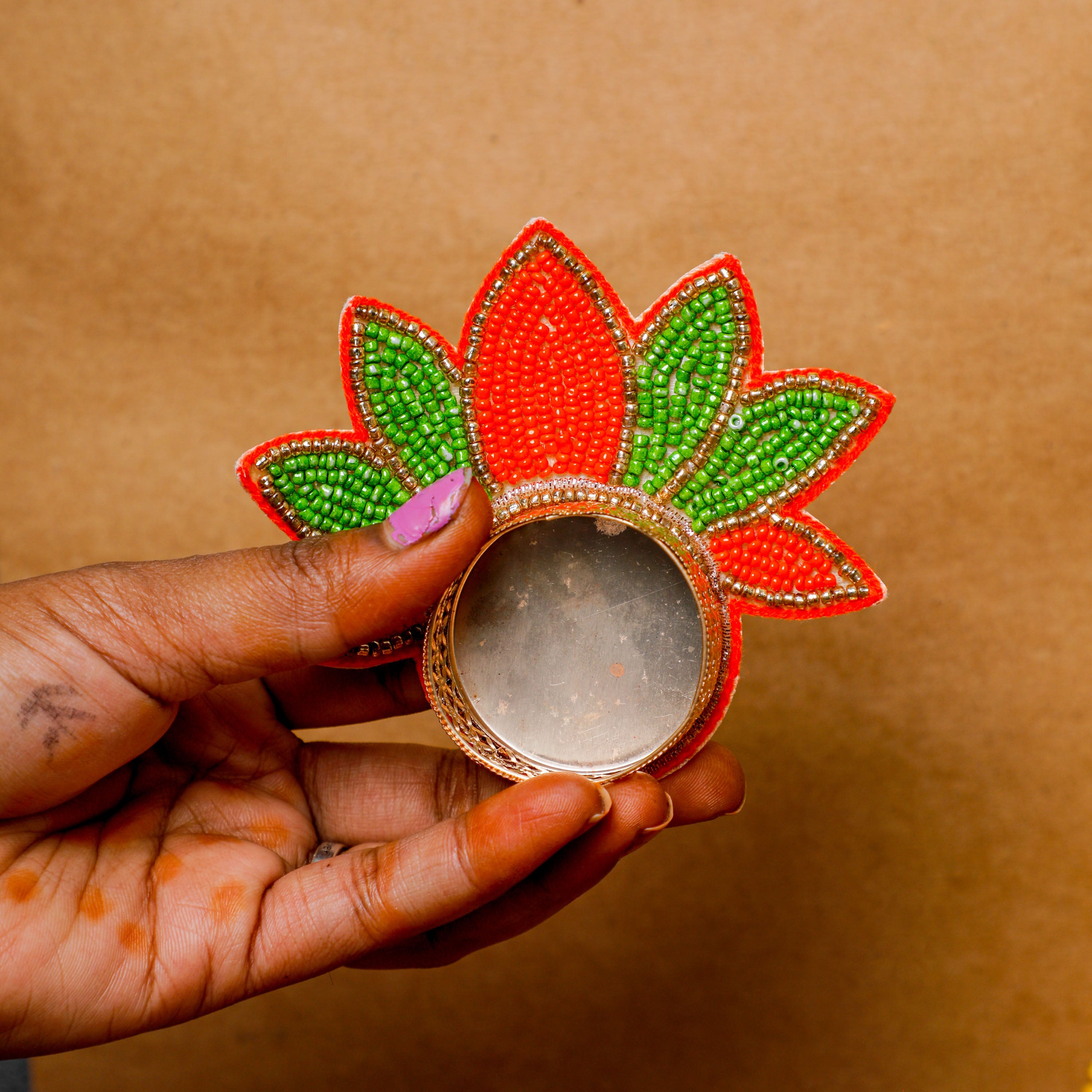 made of elegant golden metal and features lotus pattern