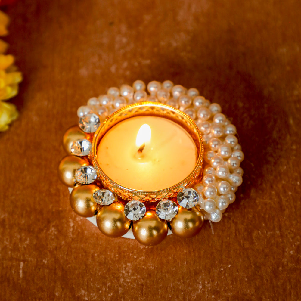 Elevate your Diwali decor with our unique candle holder embellished with pearls. 