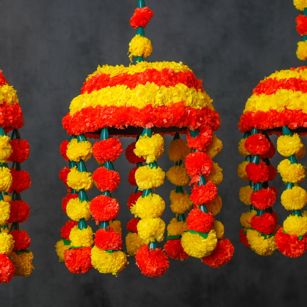 The intricate design and artificial marigold flowers add glamour to your special day