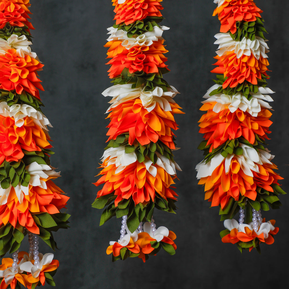 This garland is made out of fabric scraps, it has three color flowers stringed together for decoration
