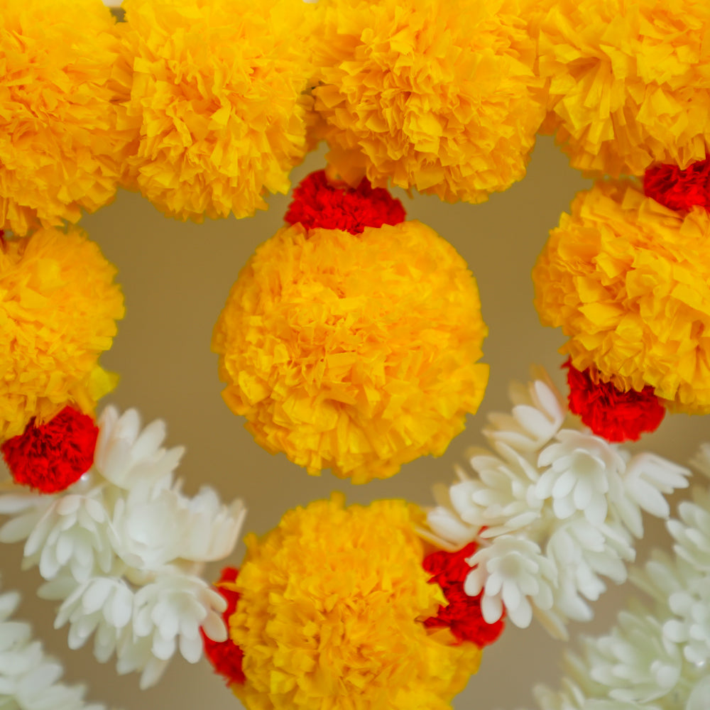 A fluffy yellow marigold flowers with white lilly