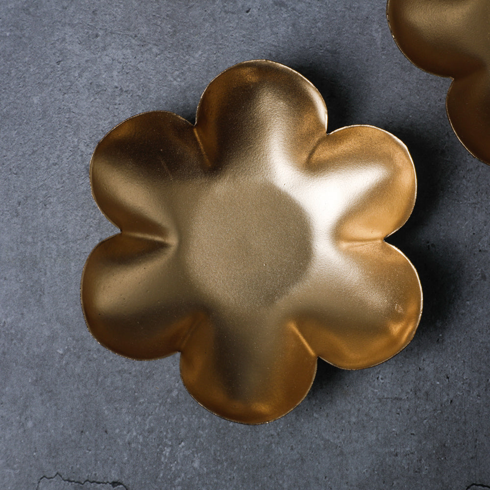 This decorative metal flower pot is unique and handmade by artisans in India