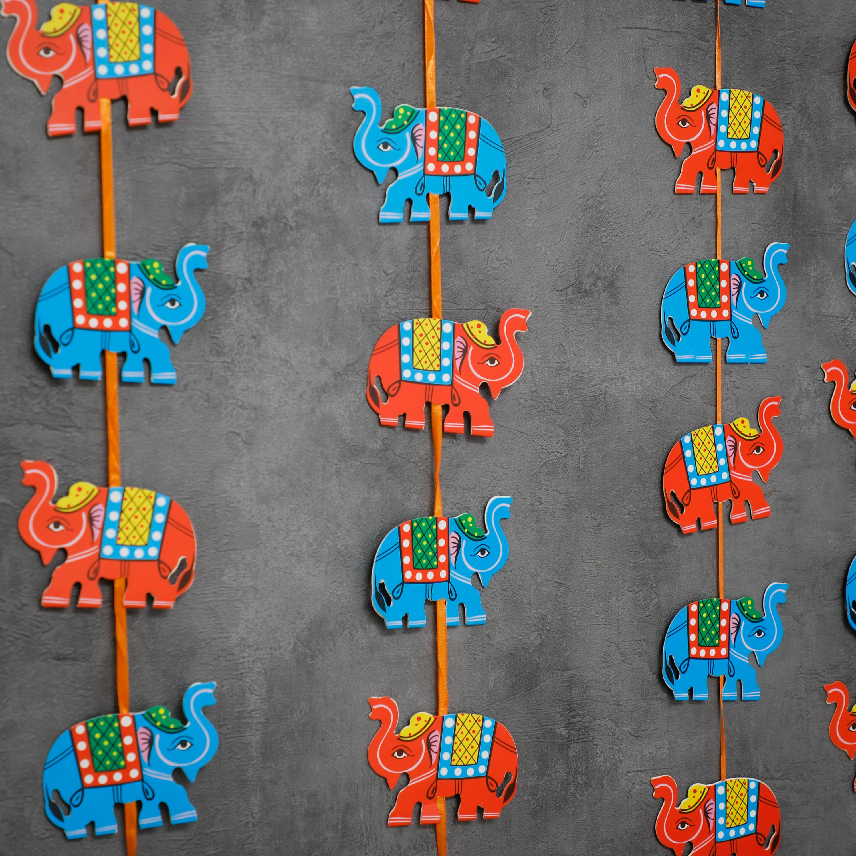 Add a pop of colour with this beautiful felt Elephant garland. The perfect finishing touch to your event