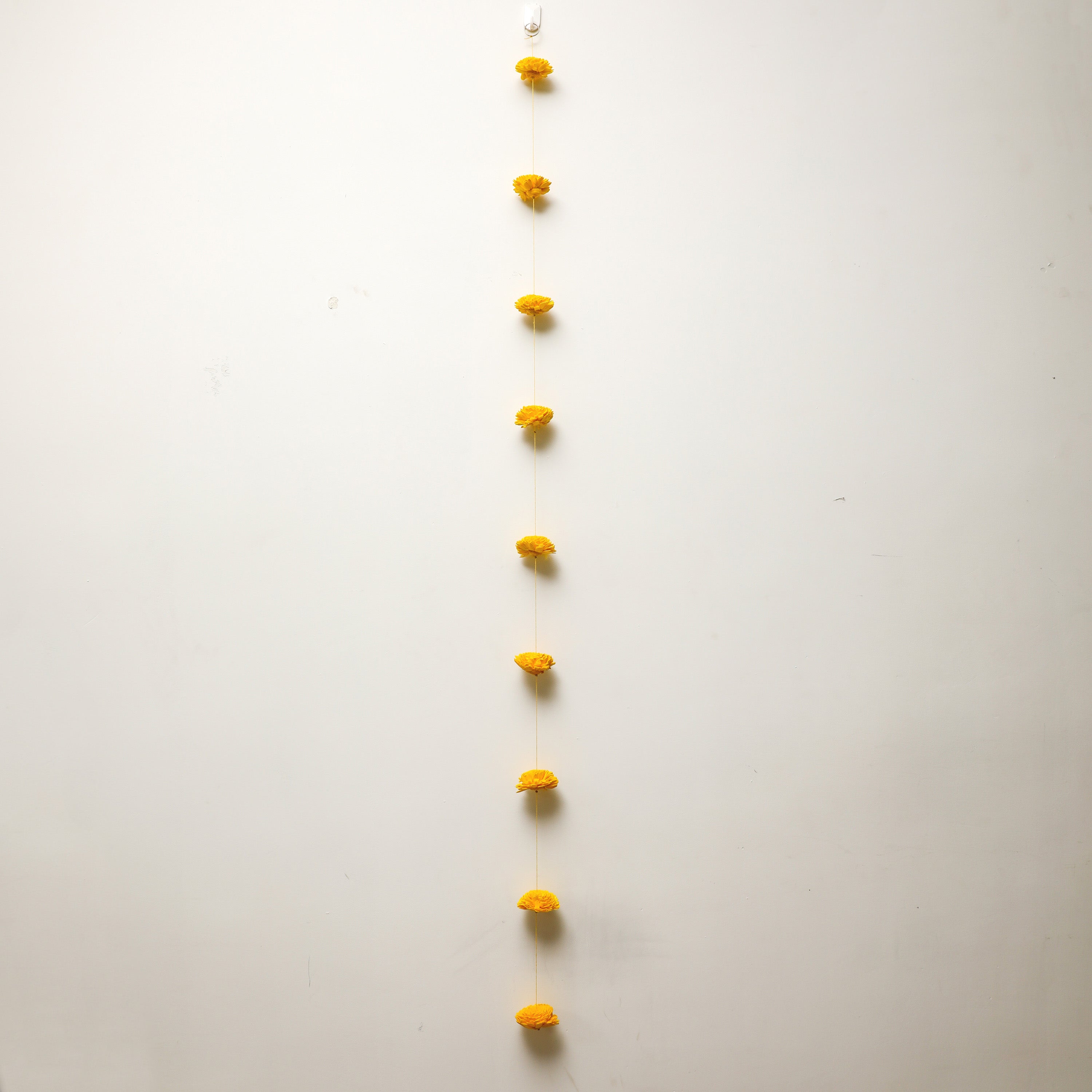 Yellow Flower Strings bring a touch of elegance and traditional charm to your space