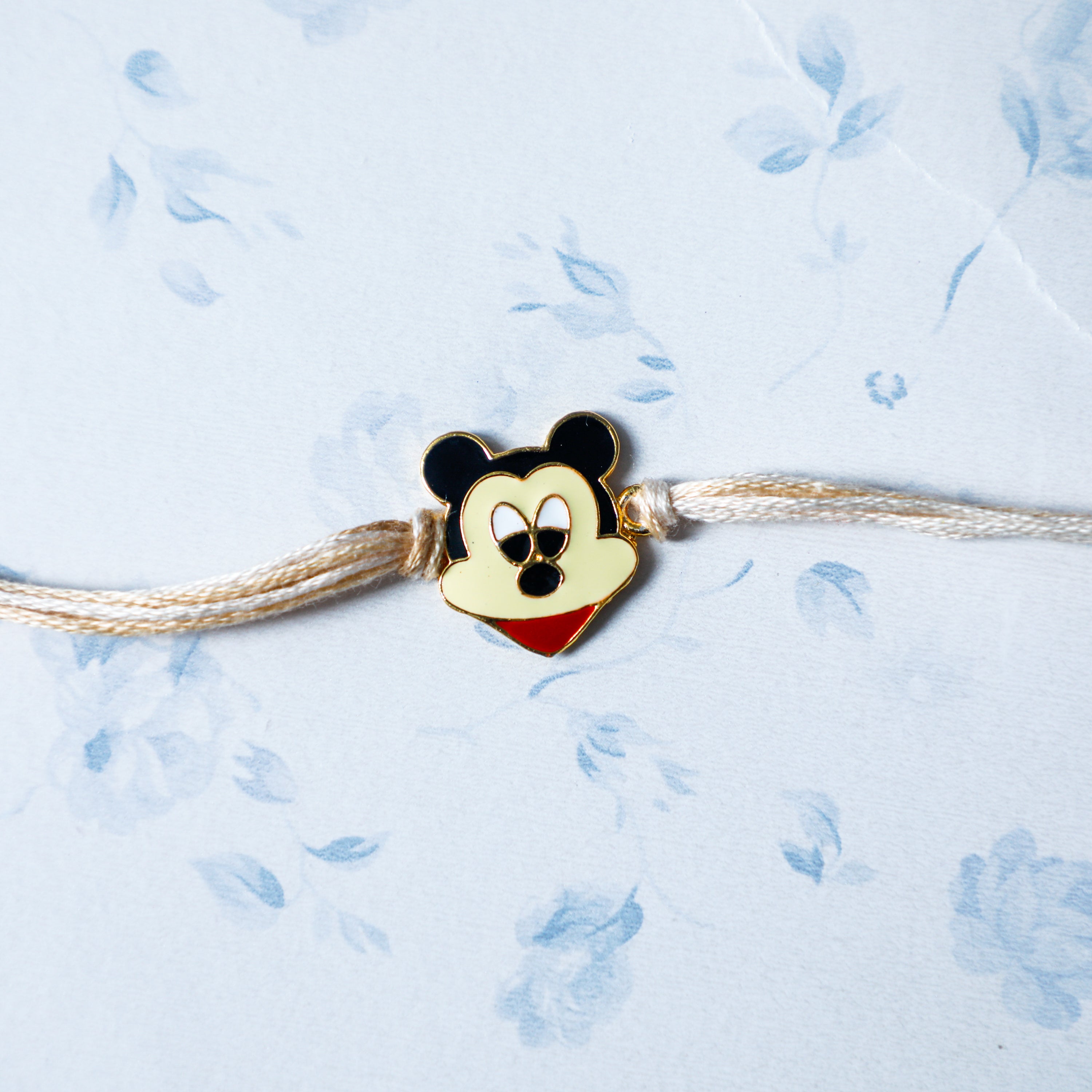 Stunning rakhi designed with intricate carved pattern