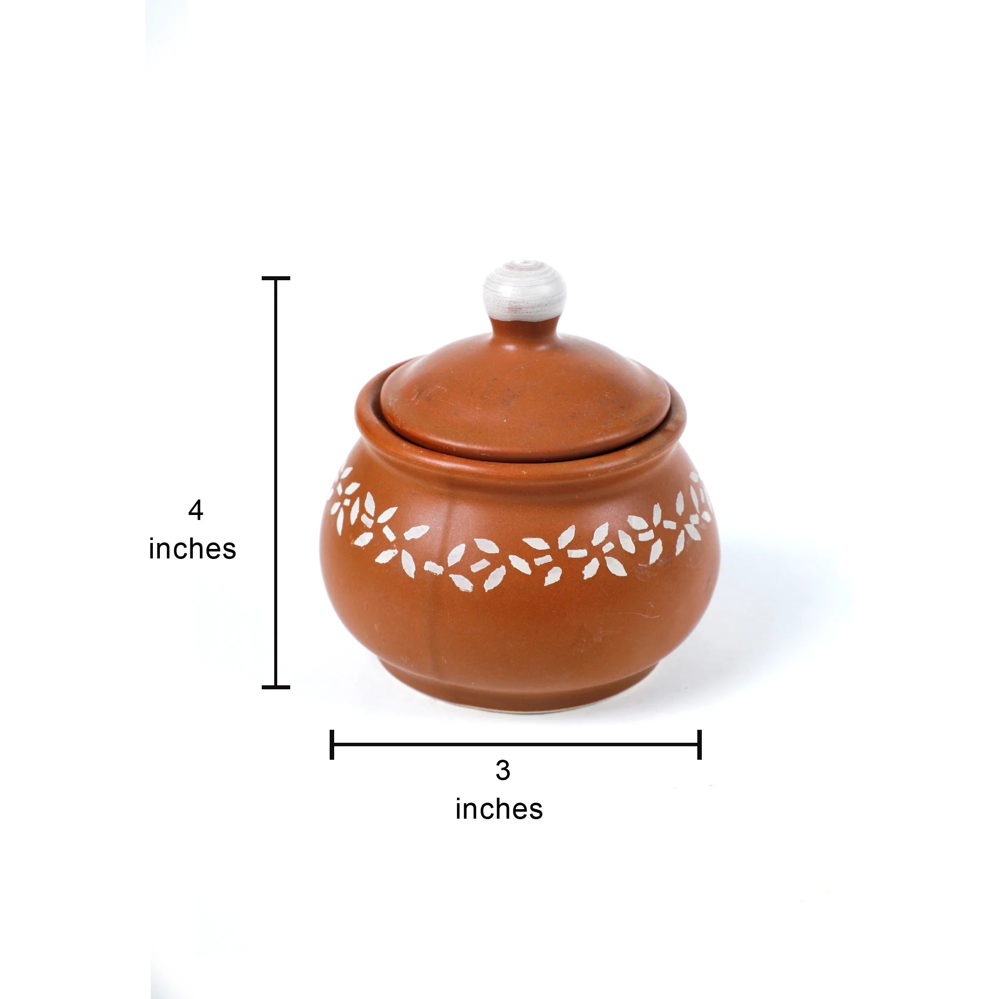 A terracotta-colored lidded ceramic jar with white floral cutout patterns on the side, shown with dimension lines indicating a height of 4 inches and a width of 3 inches on a white background.
