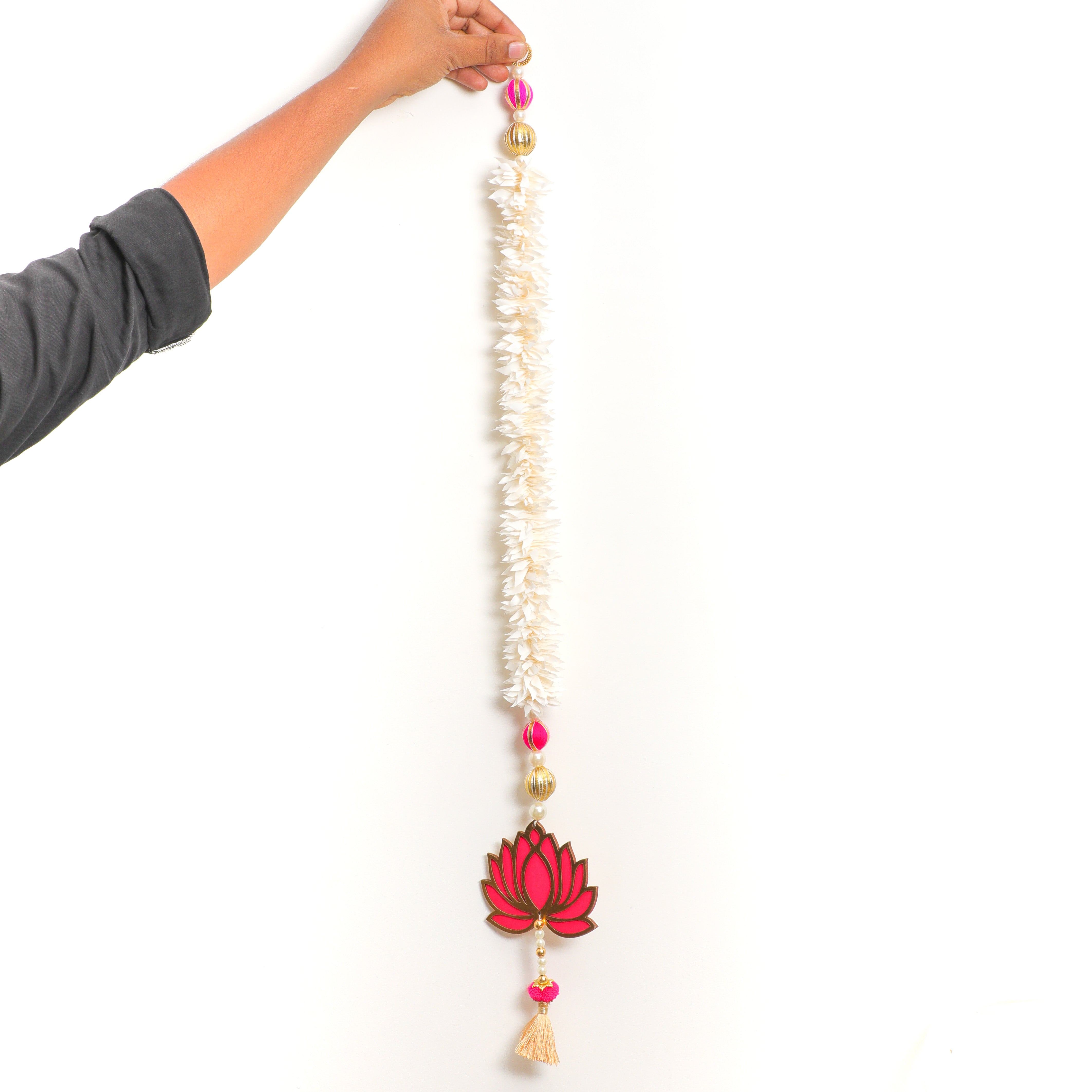 The pink and gold lotus hanging can be used for uplifting the decor at all festivities