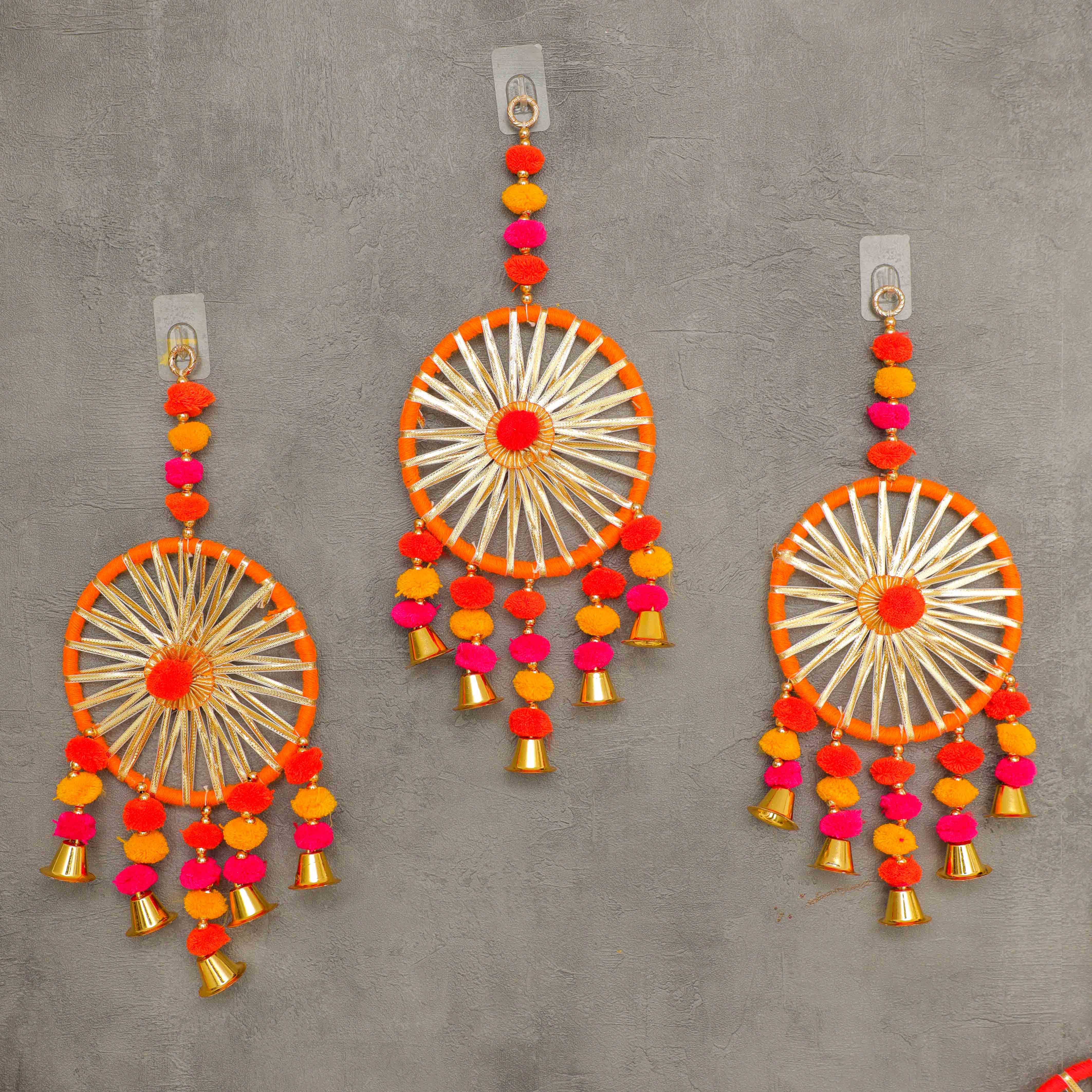 Made of fabric, wood, metal bells, and artificial materials, it's a traditional item that doubles as an attractive dream catcher