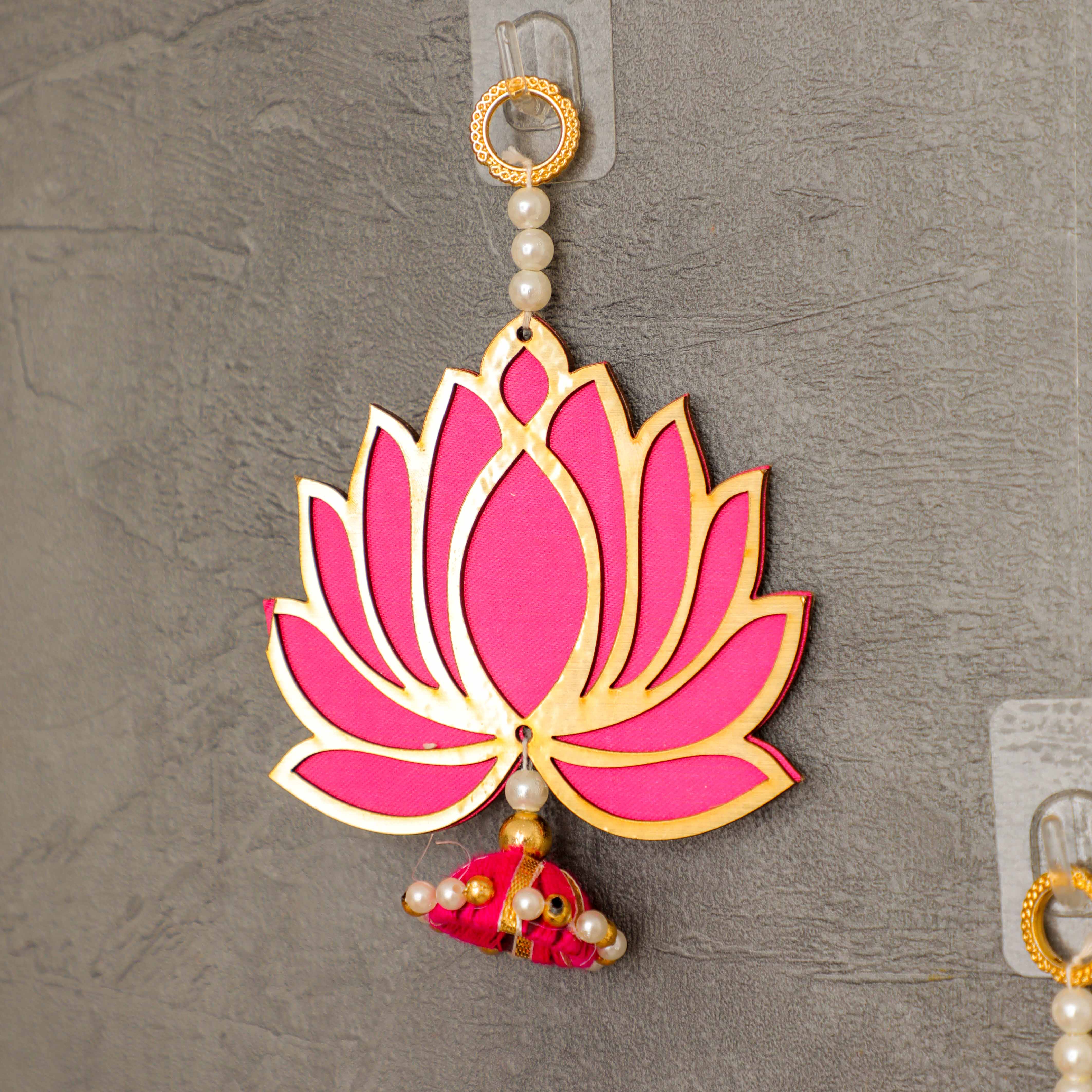 pink lotus has been outlined with a golden rim and embellished with white pearls