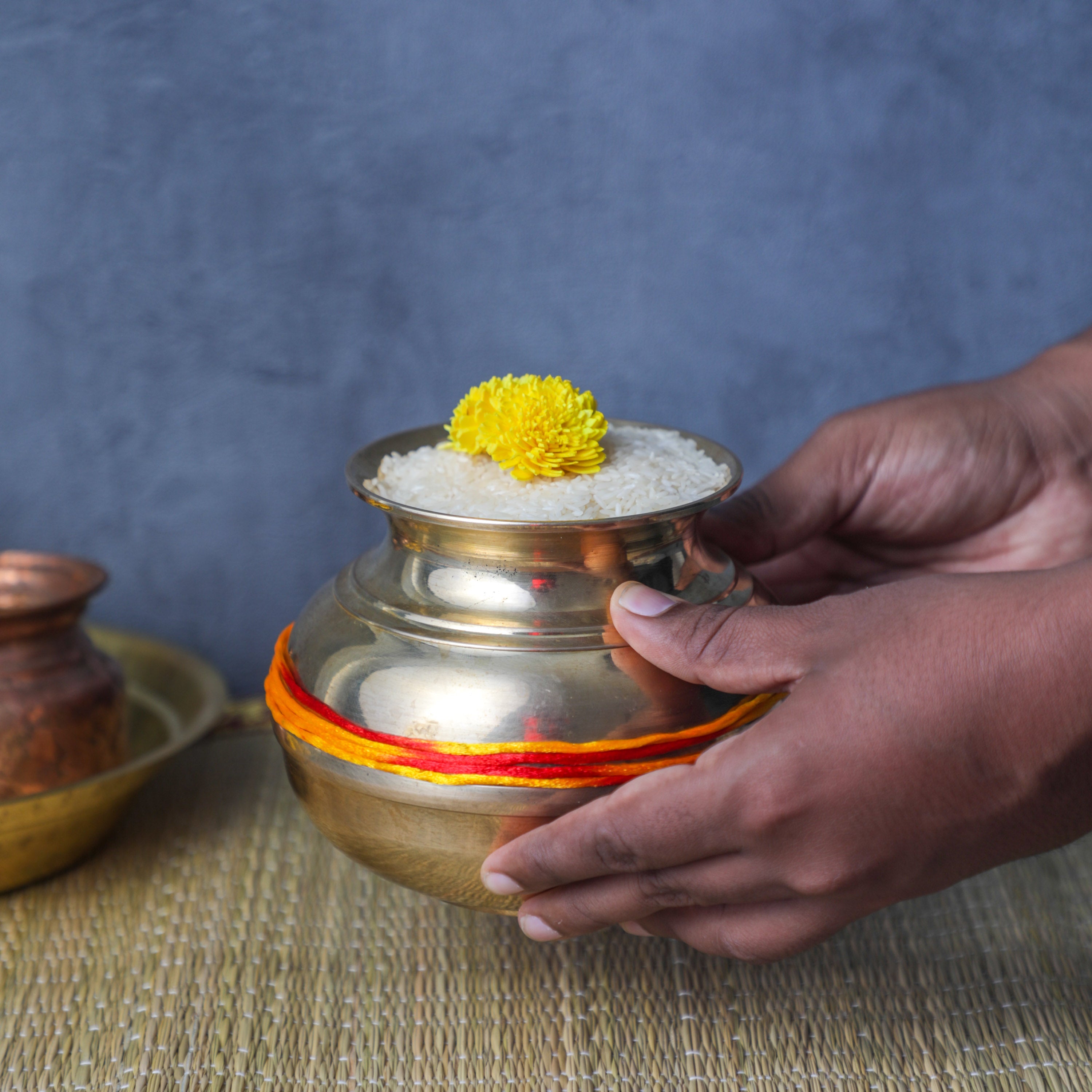 placing the housewarming vessel during pooja