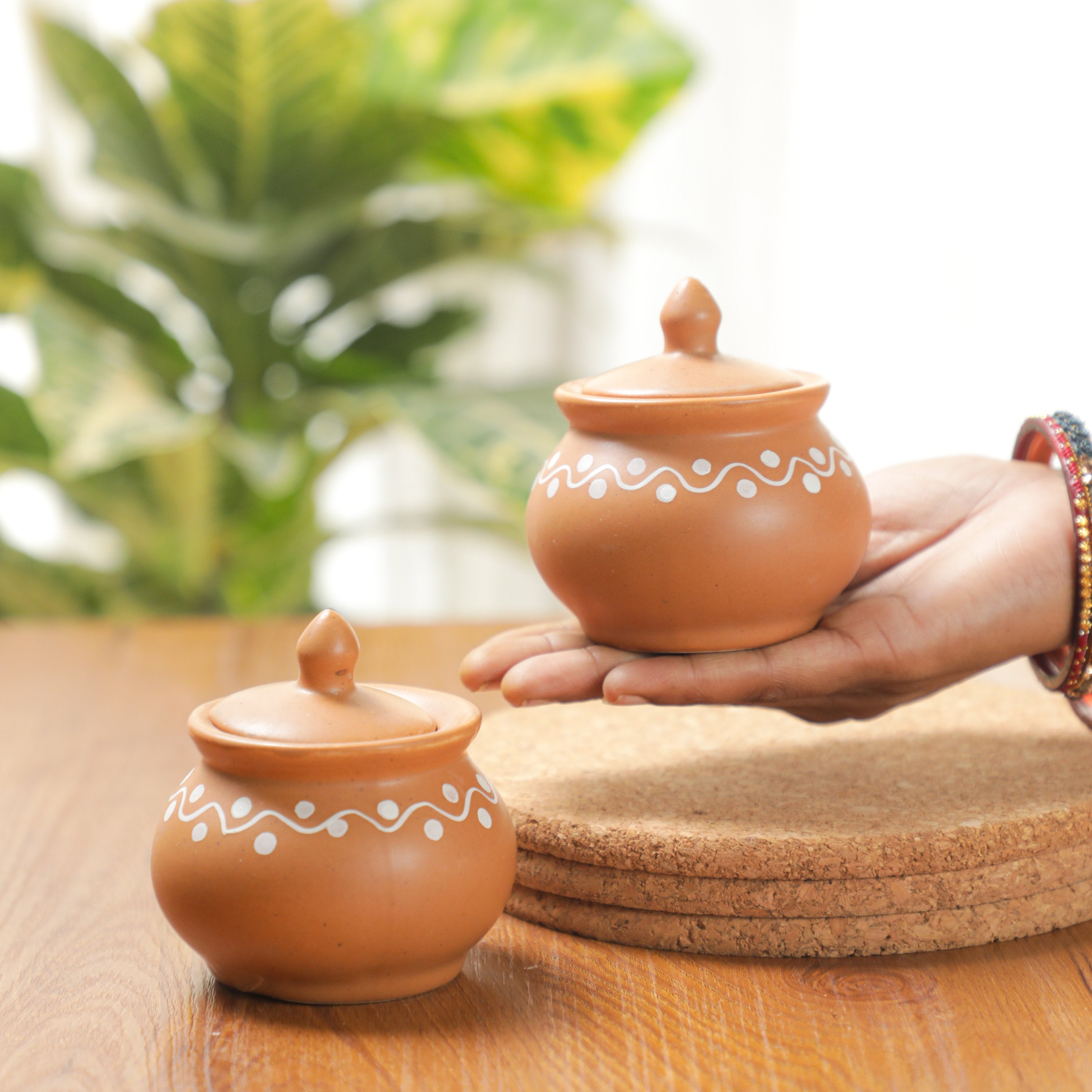 a lady holding Mini Condiment Jars in her hand