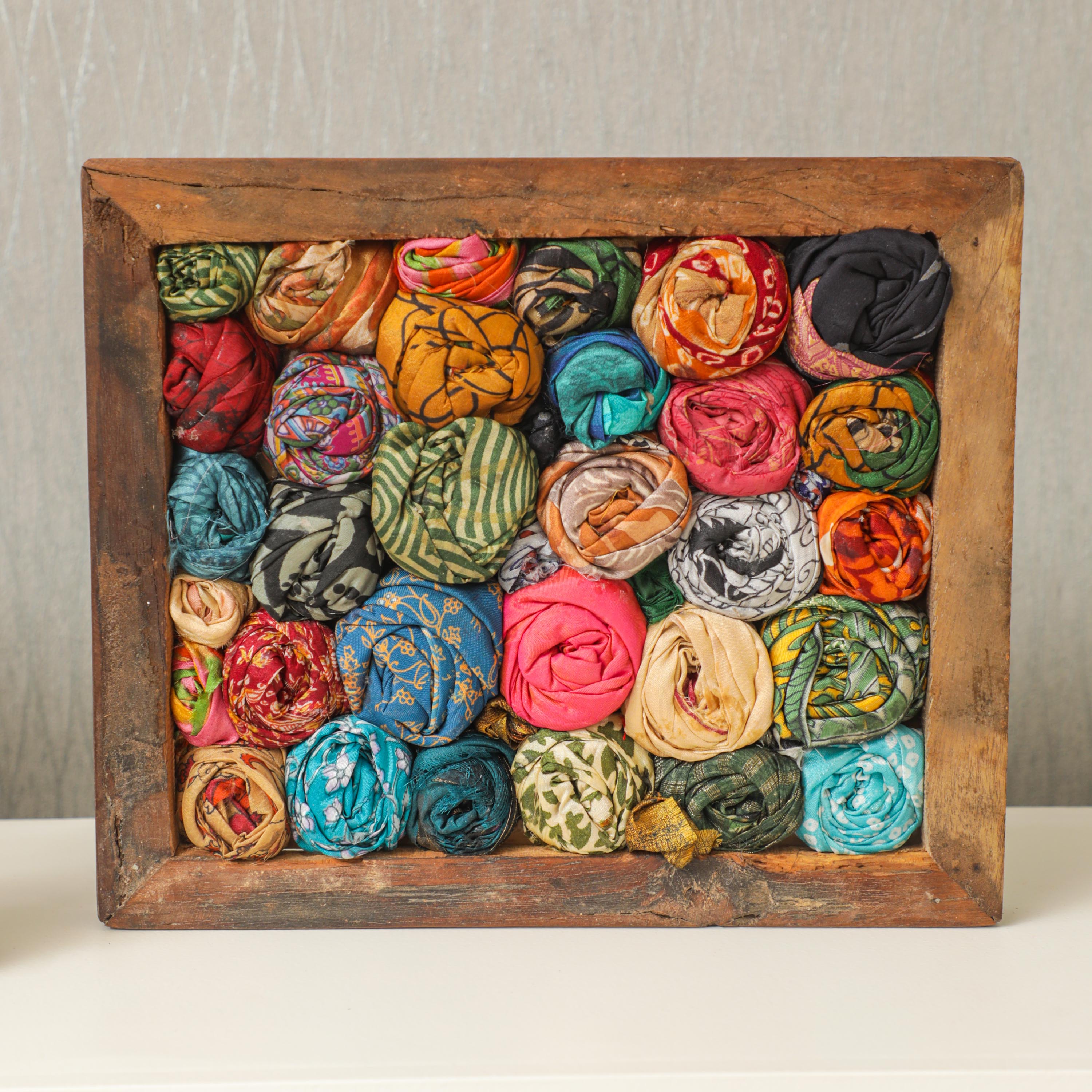 framed polyster sarees in the wooden frame