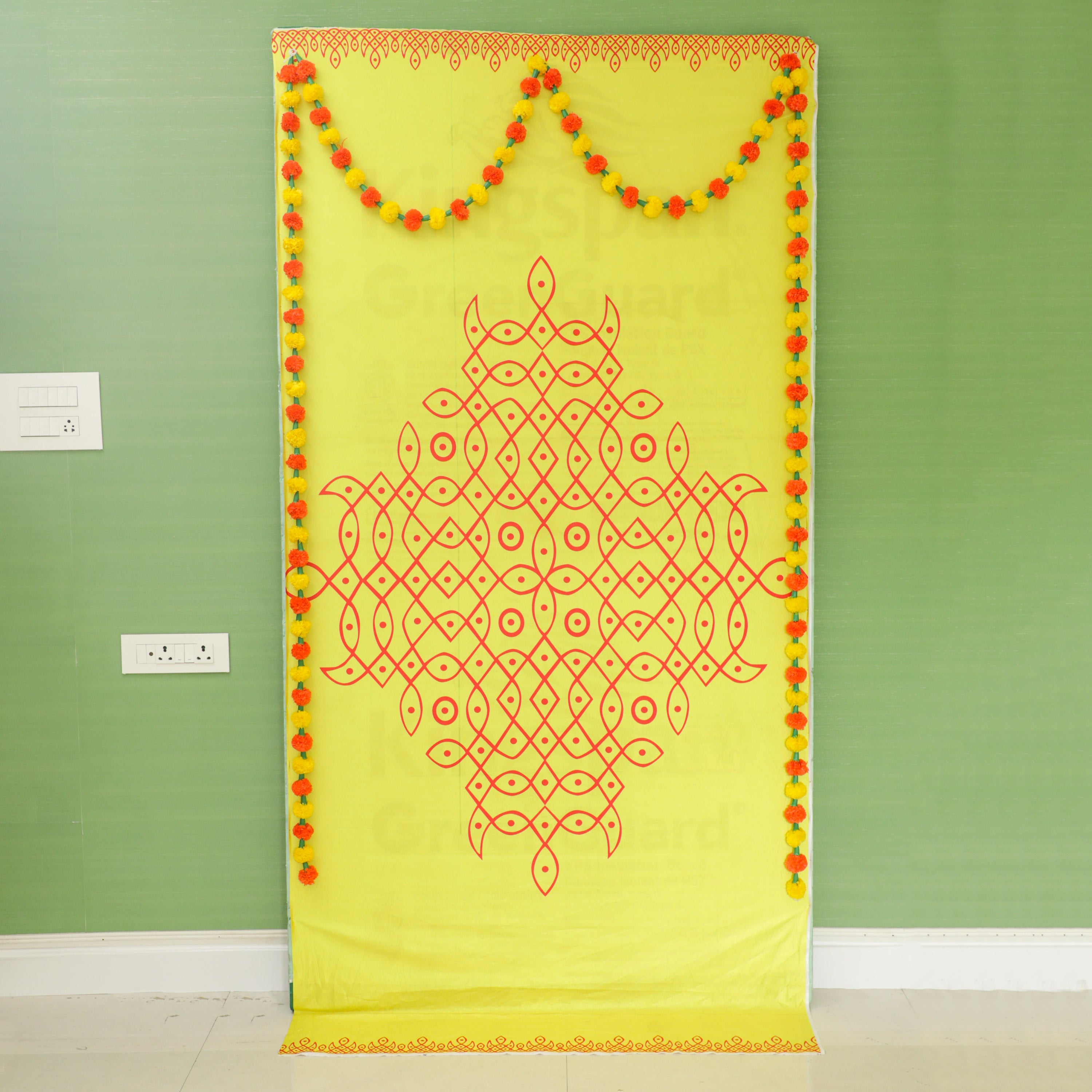 yellow color Rangoli Backdrop Cloth with garlands