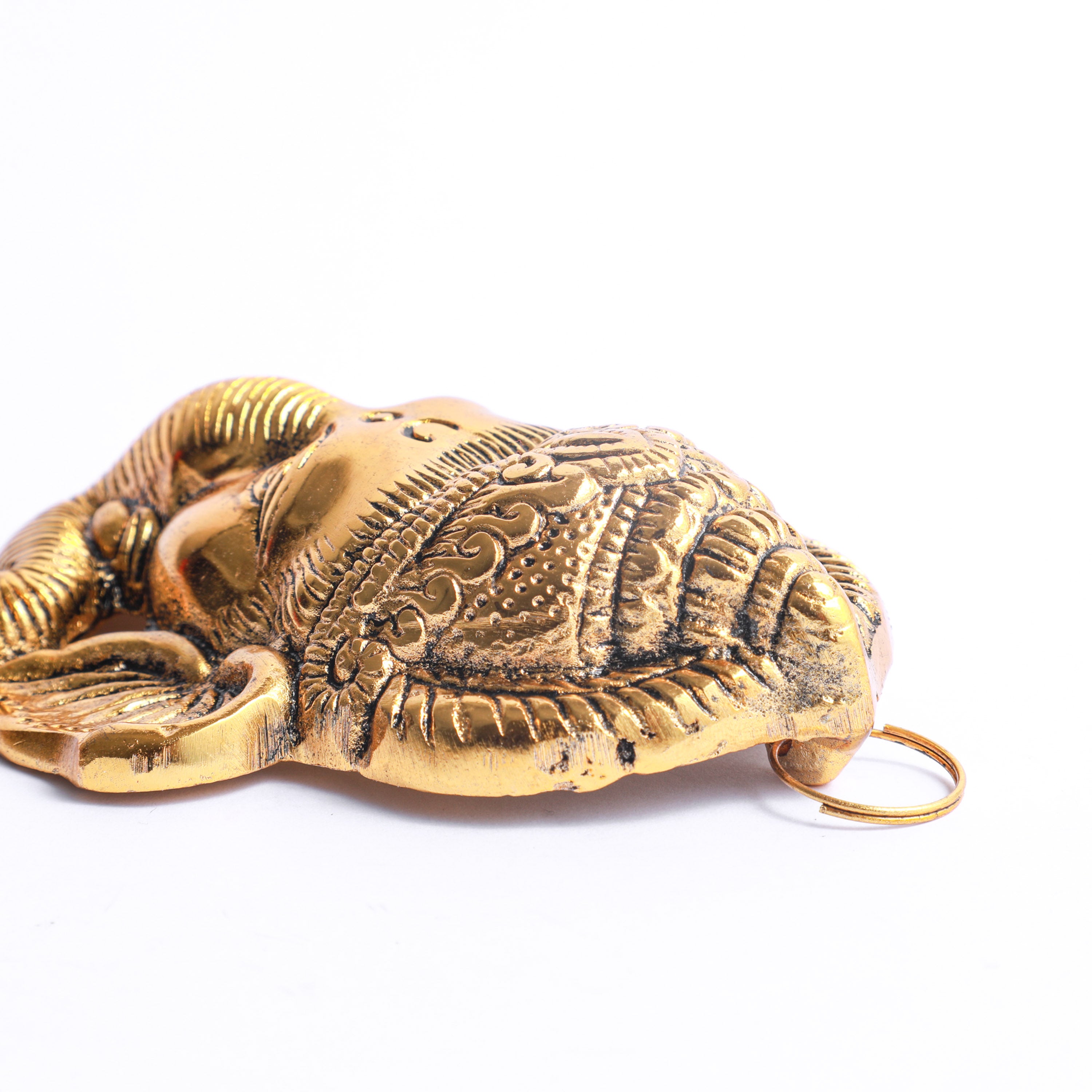 Gold-plated Ganesh Face for return gifting in the USA