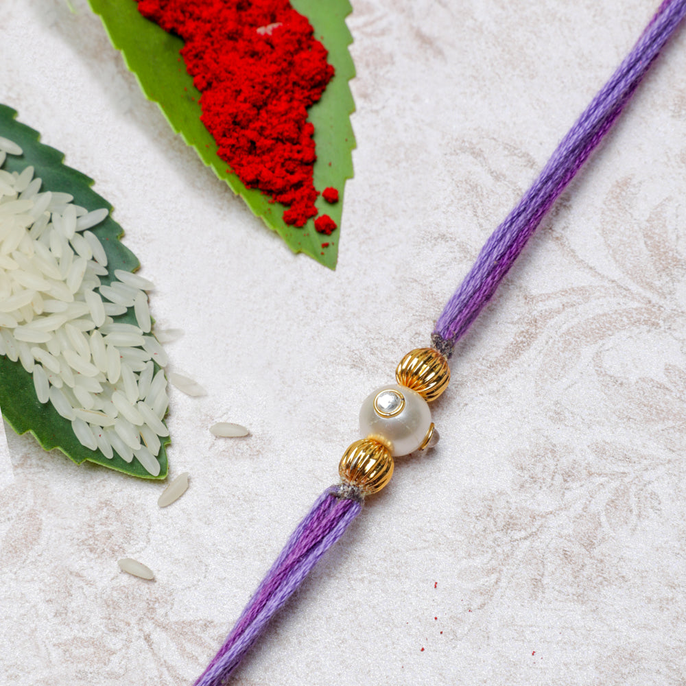 Handmade Pastel Purple Rakhi Thread With Pearl and Gold Beads 