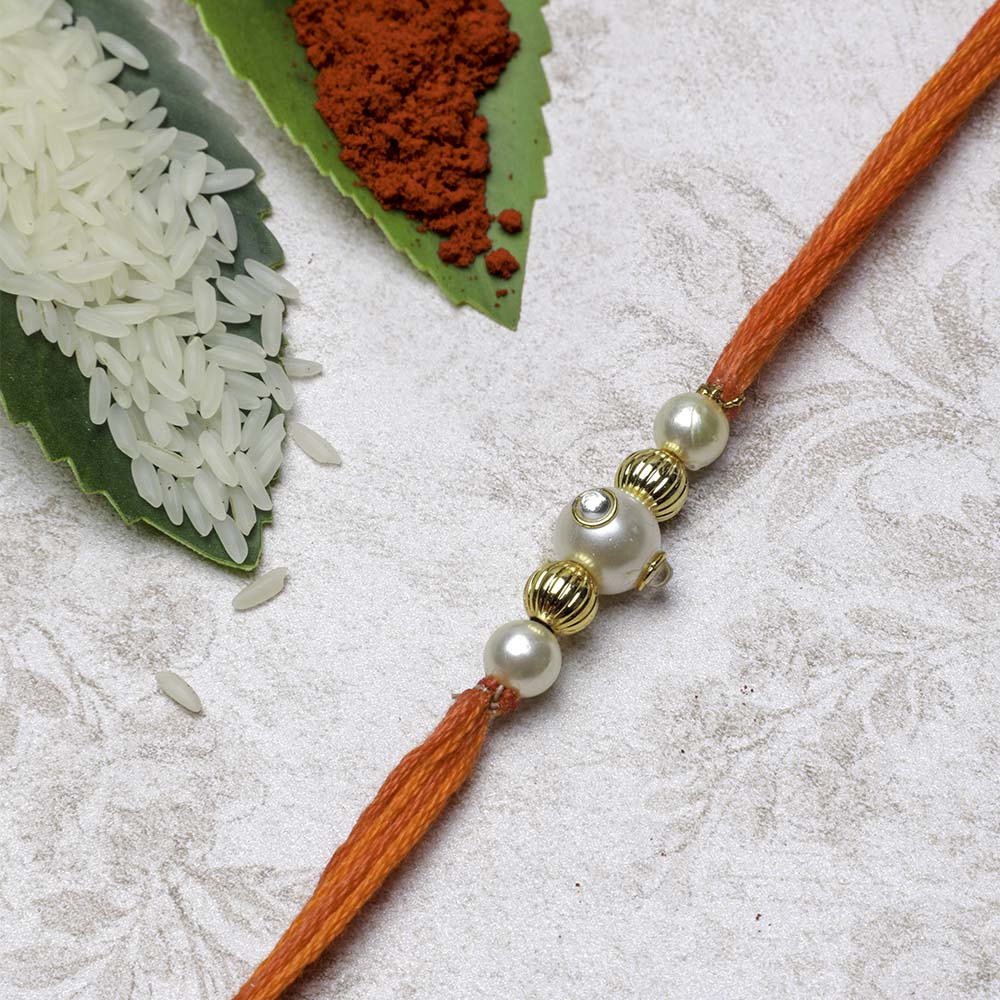 3 Kinder Joy with Pearl Rakhi and Roli-Chawal