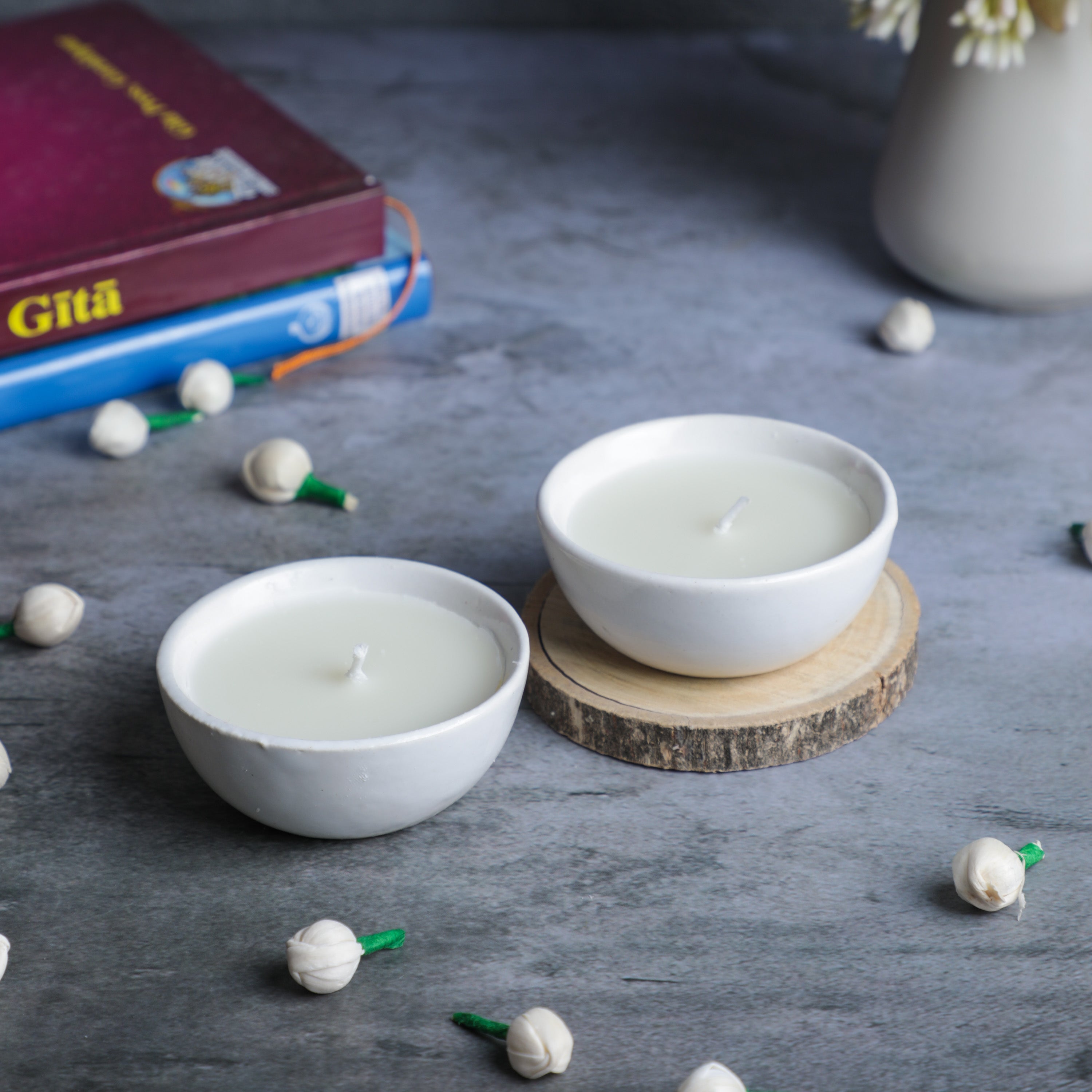 jasmine scented candles in ceramic bowl