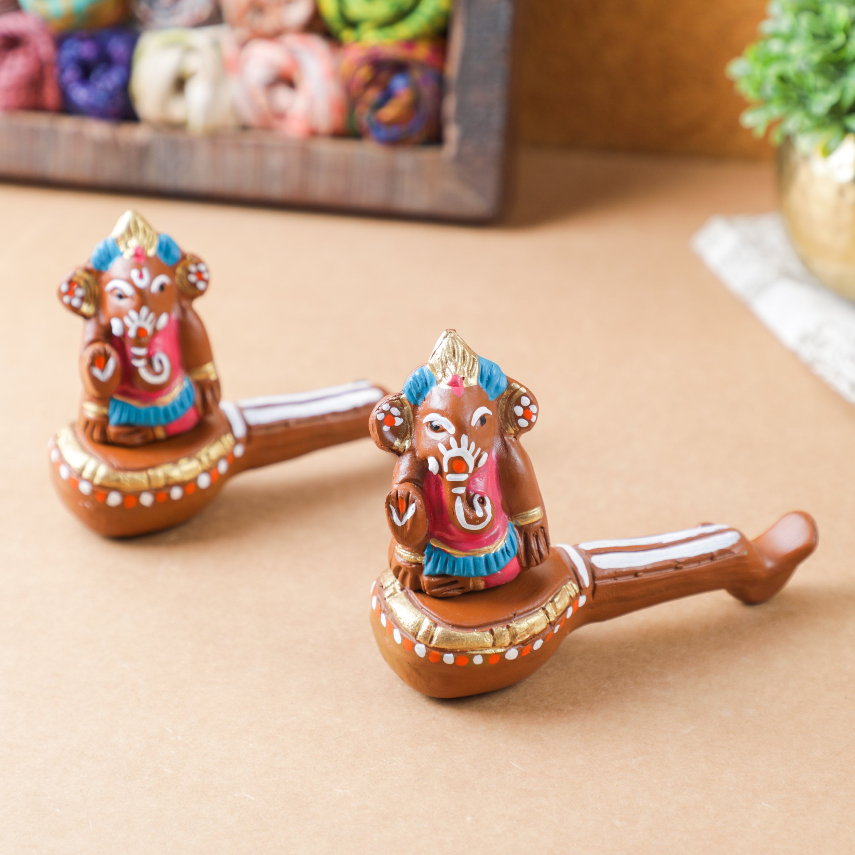 ganesha sitting on veena made with natural clay