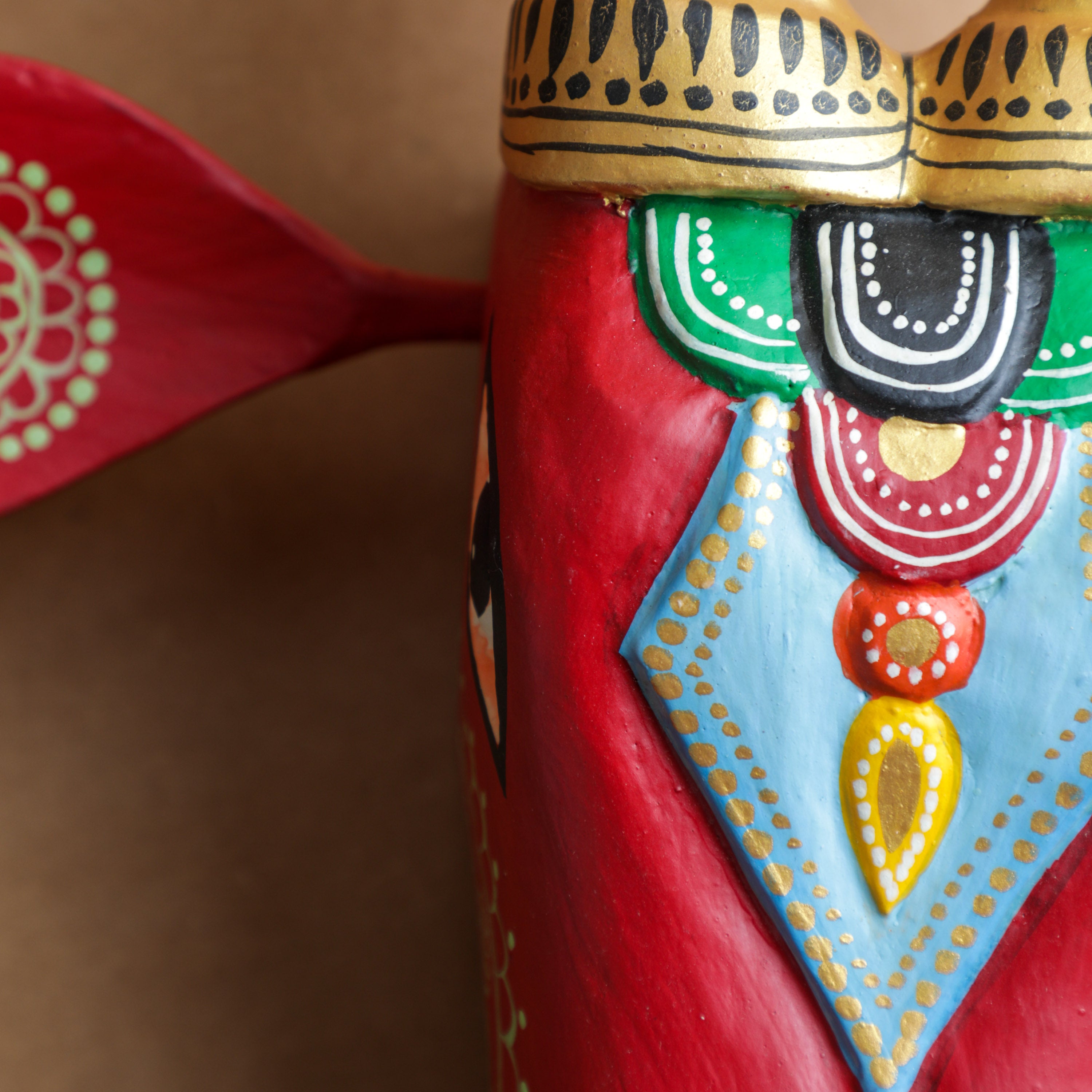 hand painted with exquisite motifs and the subtle colours in green, red and blue colors on wood