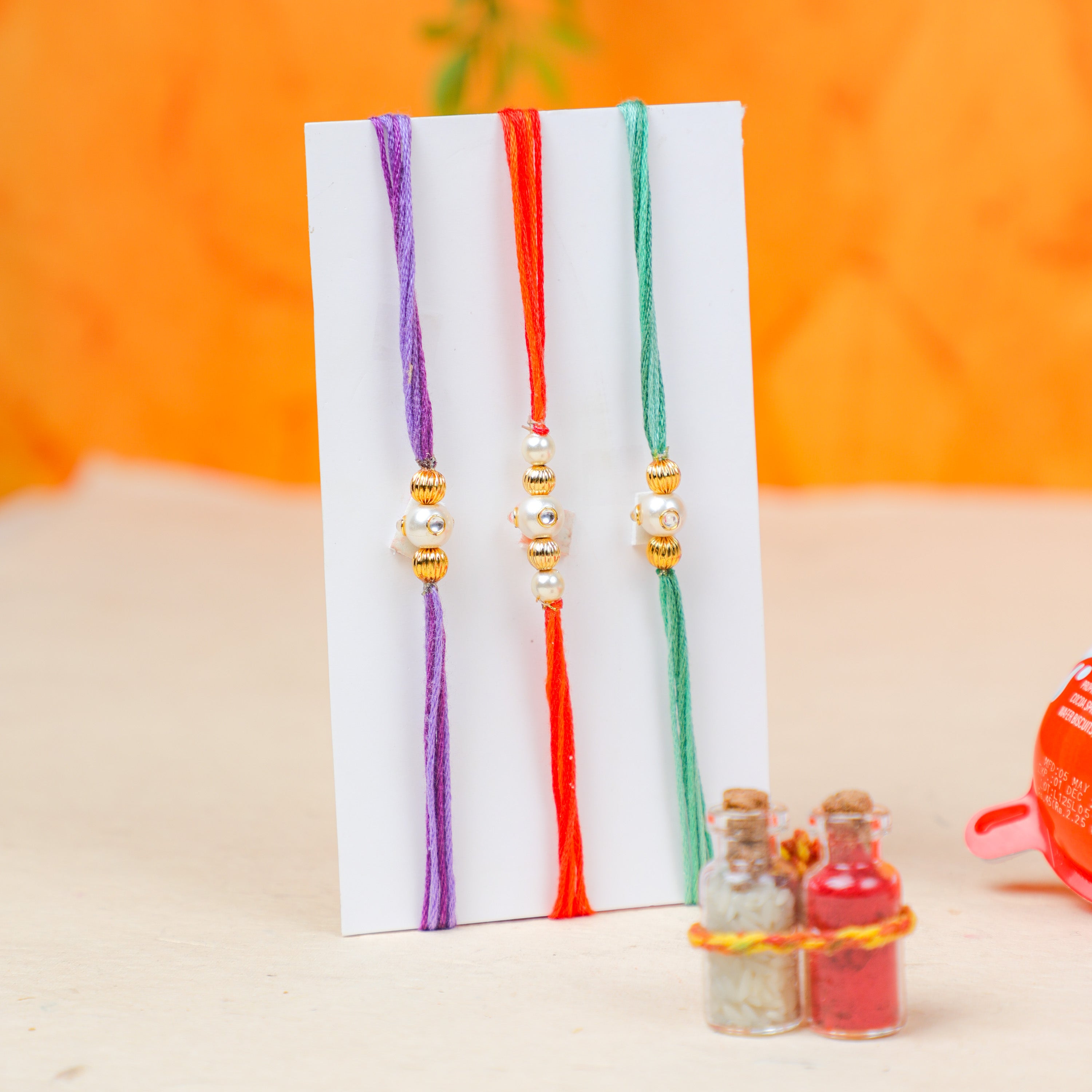 3 Kinder Joy with Pearl Rakhi and Roli-Chawal