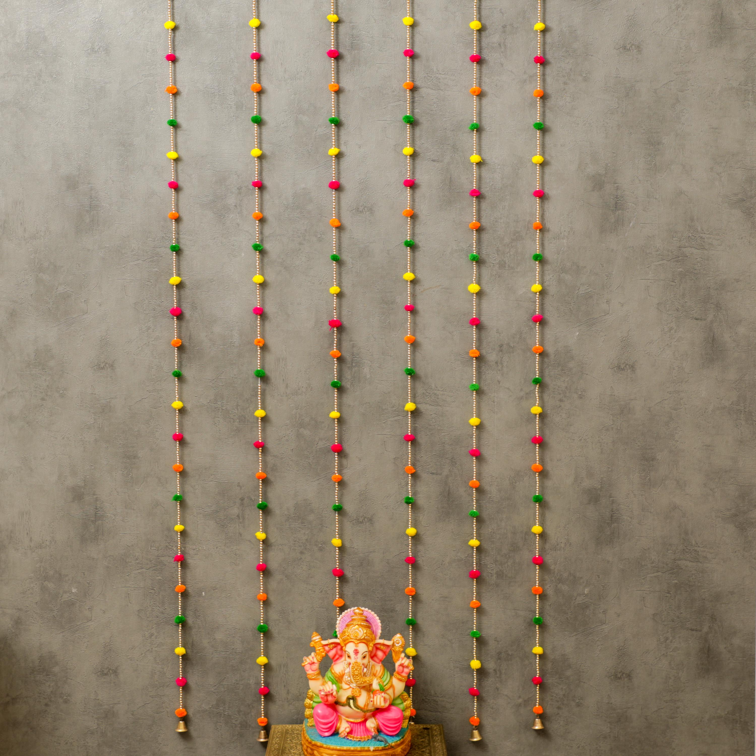 The garland is strung together with a thin thread and small bell attached to the end