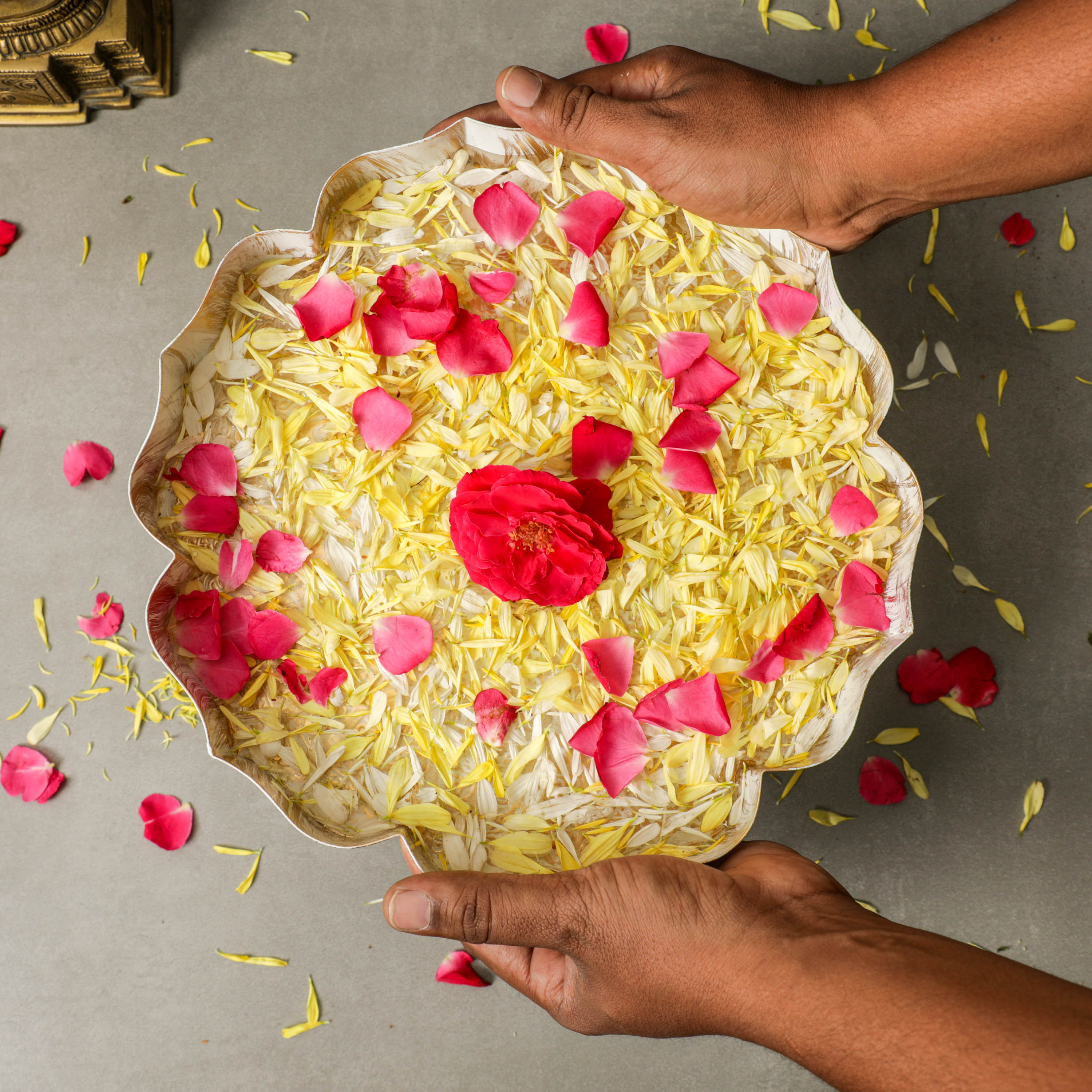 A person holding the URLI filled with flowers