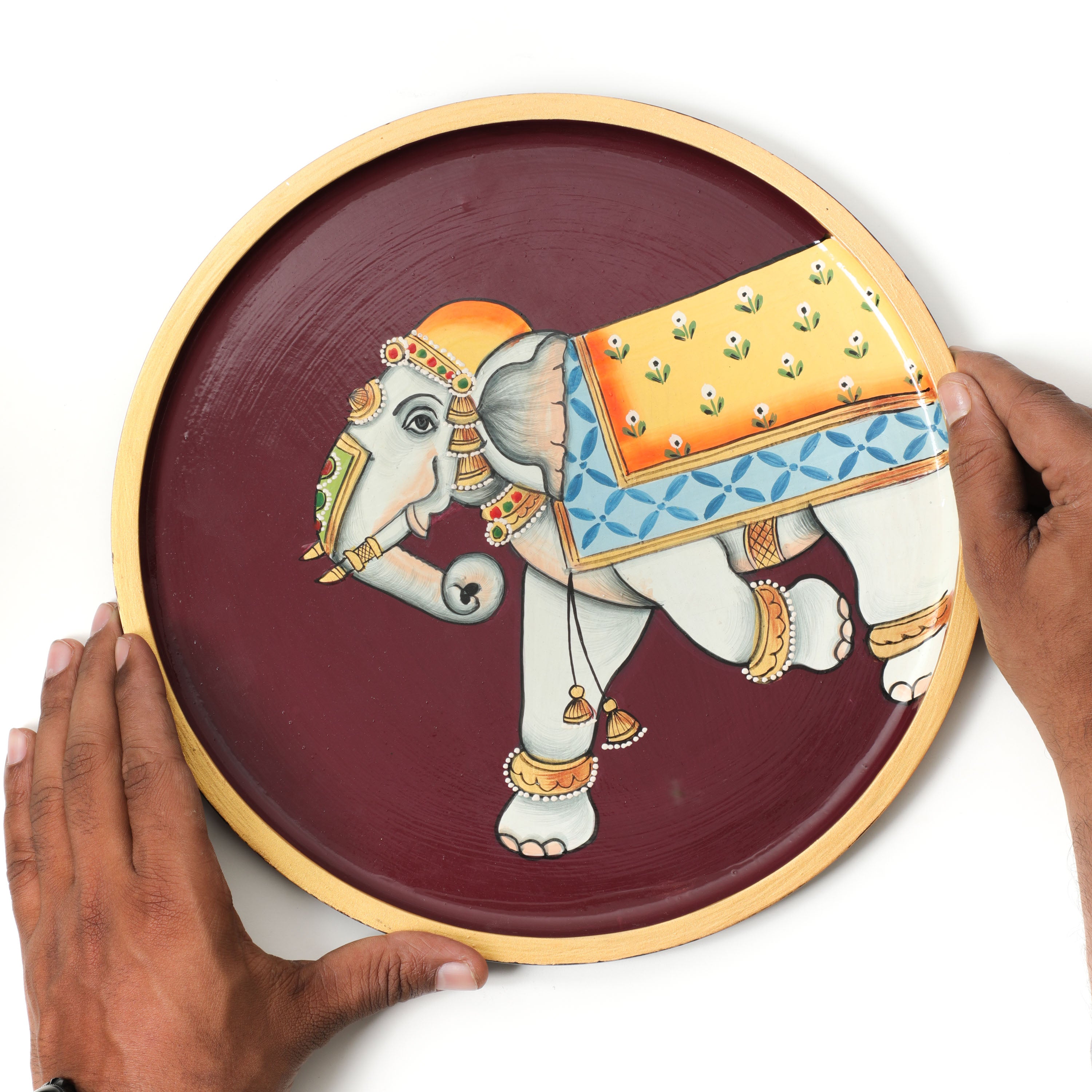 Crafted with a convenient knob for easy hanging, our Elephant Pichwai Wall Plates are the perfect addition to your home decor.
