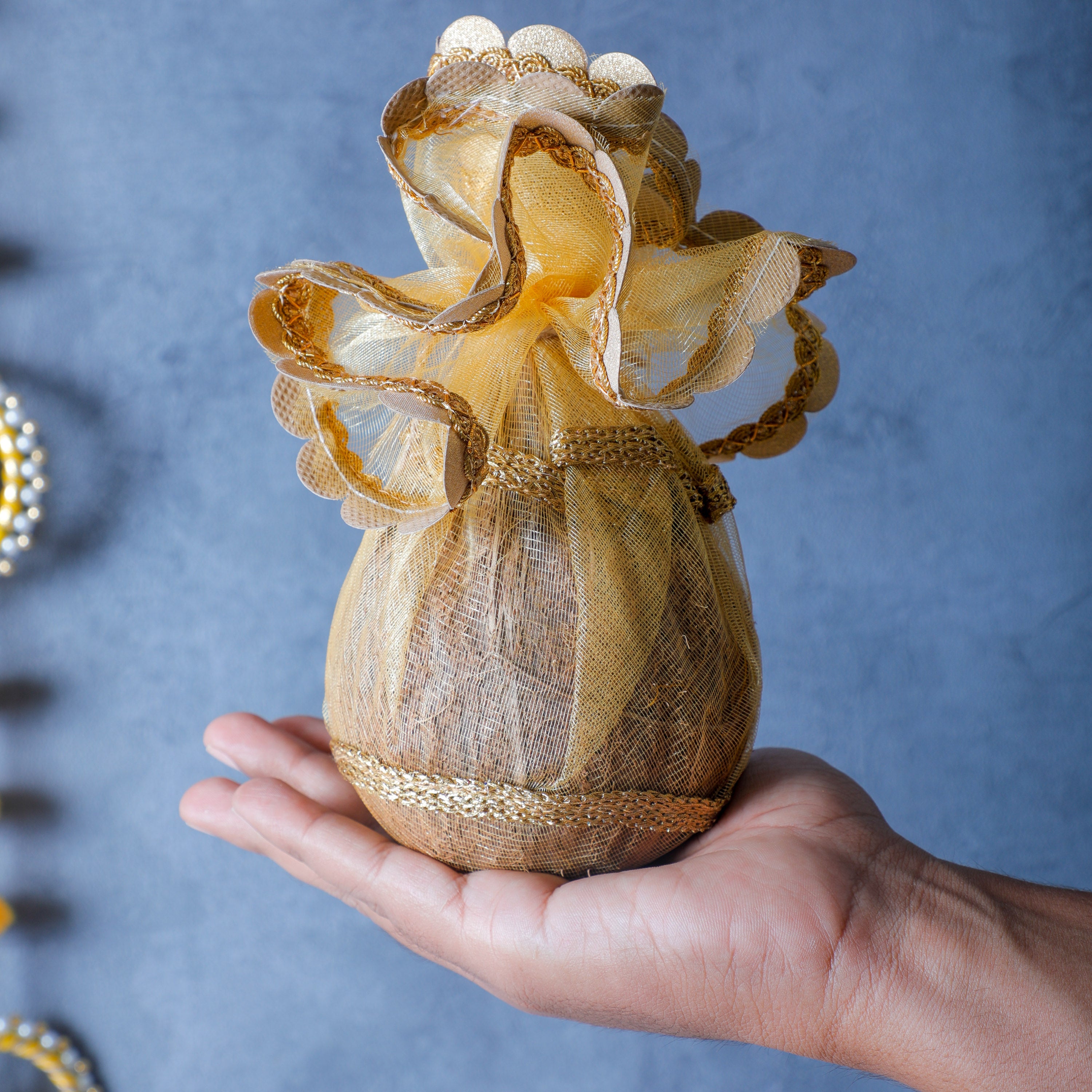 This coconut cover is in elegant gold color, which is used for marriage ceremony and functions