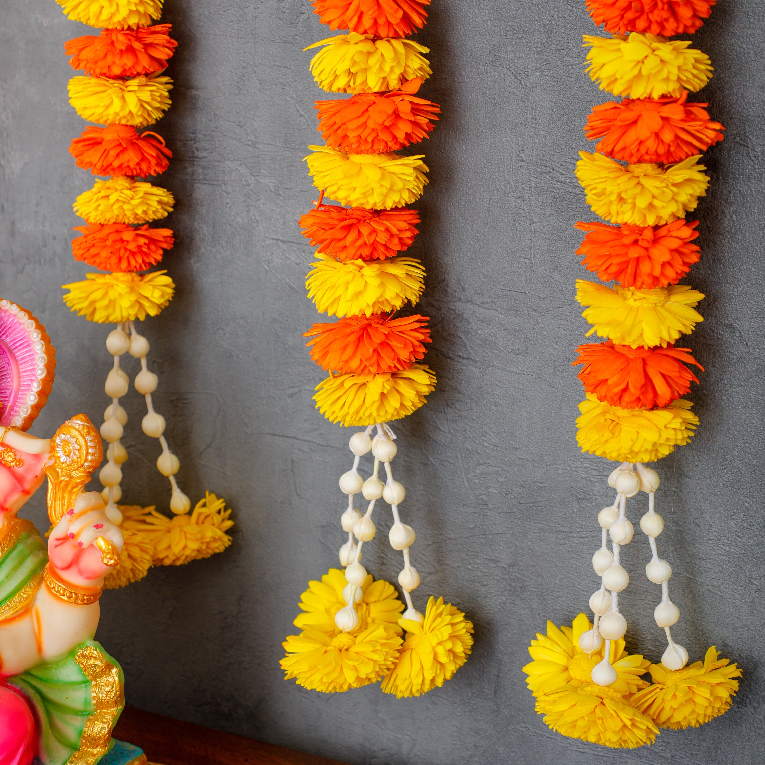 Our garlands can be used for decorating Hindu God pictures, adding an elegant touch to your pooja room