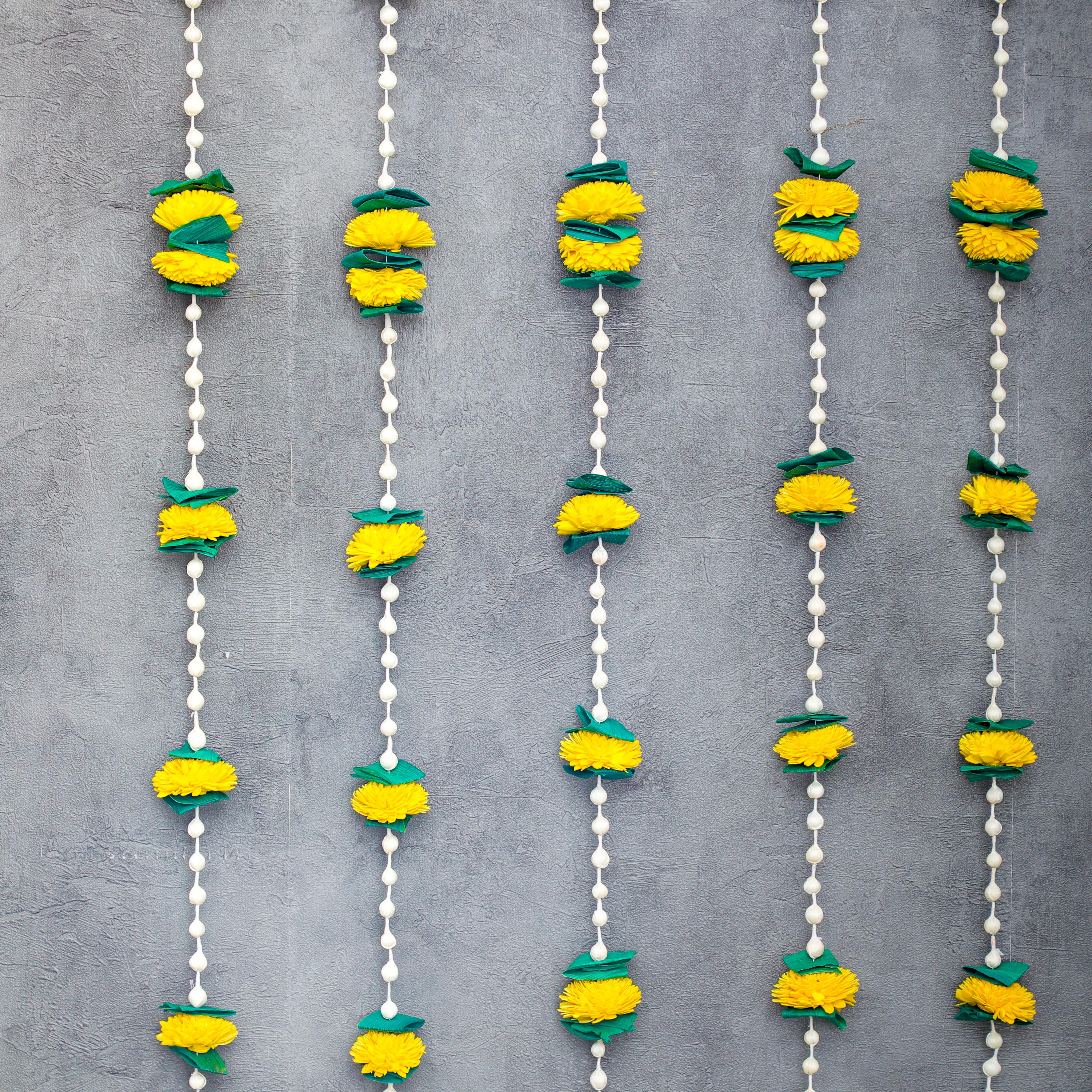 The hanging garland is made from Solawood and palm which dry stem part of the plant