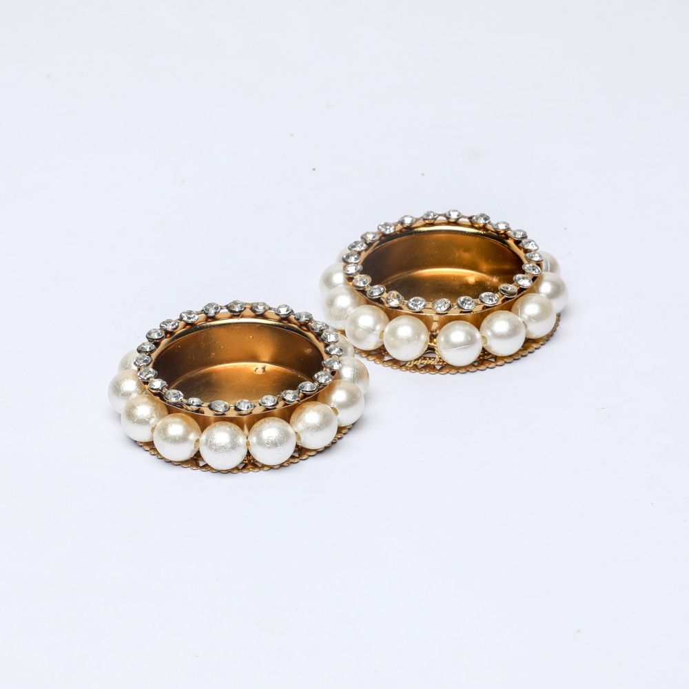 Gold tealight holders with pearls for Diwali gifting