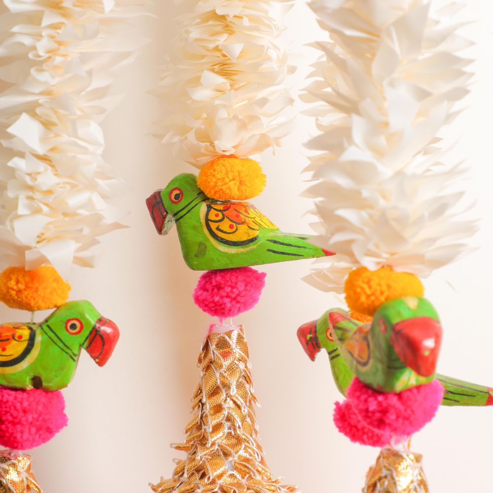 artificial floral garlands with woolen and fabric with wood parrot.