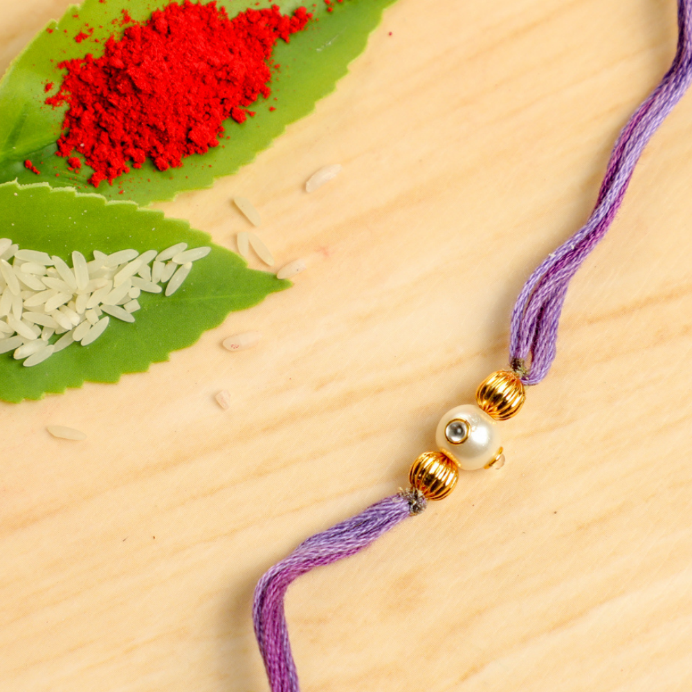 Handmade Pastel Purple Rakhi Thread With Pearl and Gold Beads