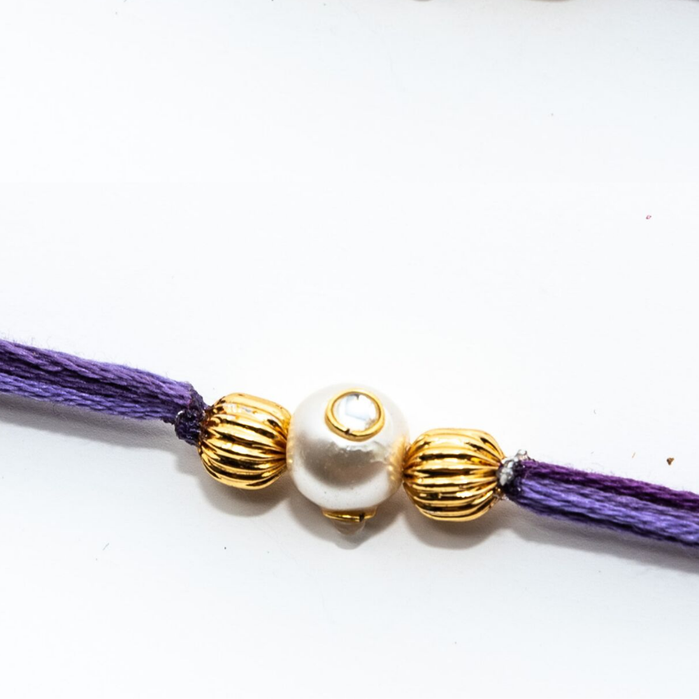 Handmade Pastel Purple Rakhi Thread With Pearl and Gold Beads